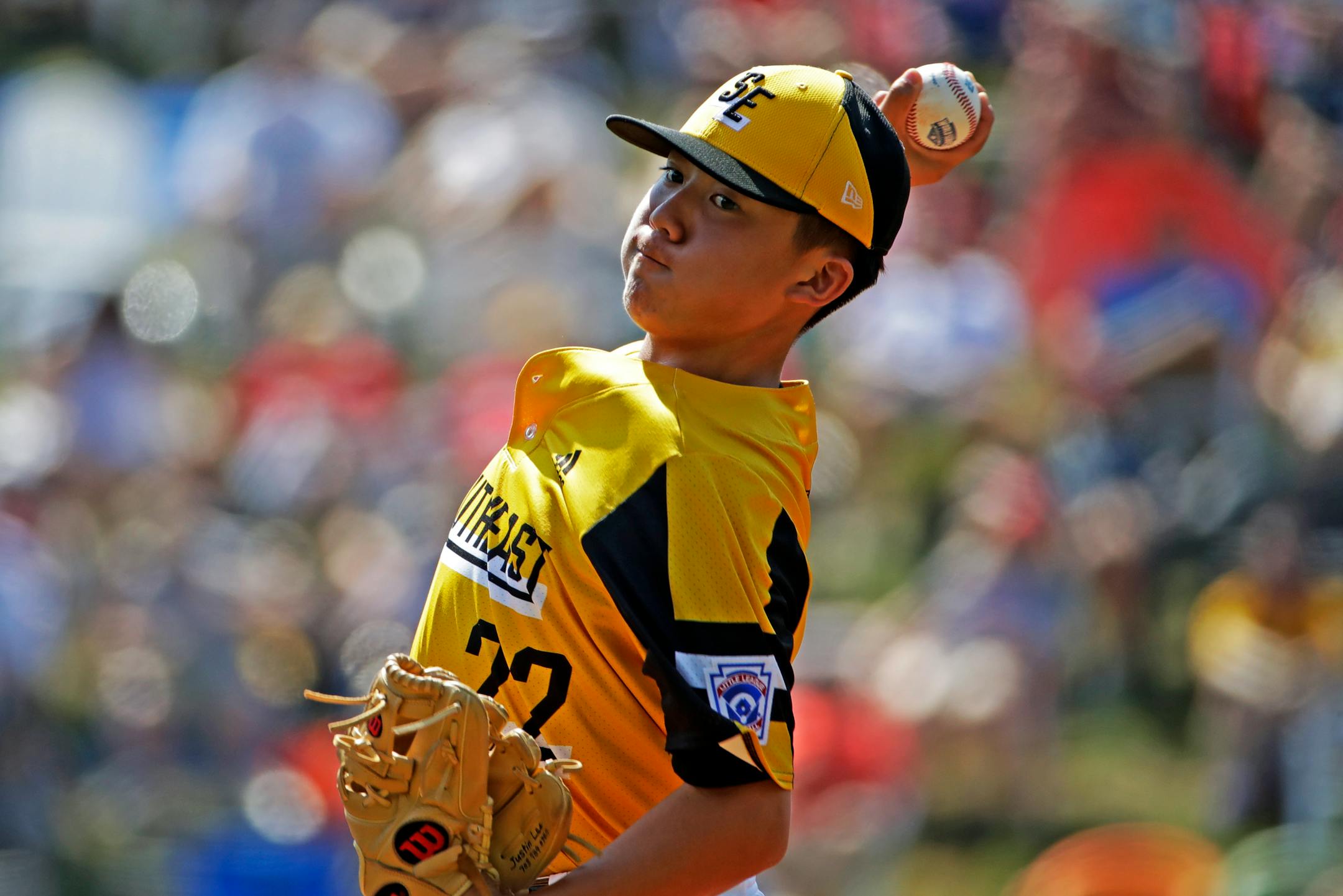 South Riding, Virginia pitcher Justin Lee delivers during the first inning of a baseball game against Coon Rapids, Minnesota at the Little League World Series tournament in South Williamsport, Pa., Sunday, Aug. 18, 2019. Virginia won in four innings, 11-0, with Lee allowing no hits. (AP Photo/Gene J. Puskar)