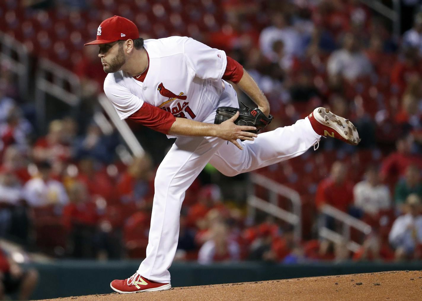 St. Louis Cardinals starting pitcher Lance Lynn watches a delivery during the first inning of a baseball game against the Cincinnati Reds on Tuesday, Sept. 12, 2017, in St. Louis. (AP Photo/Jeff Roberson) ORG XMIT: MOJR103