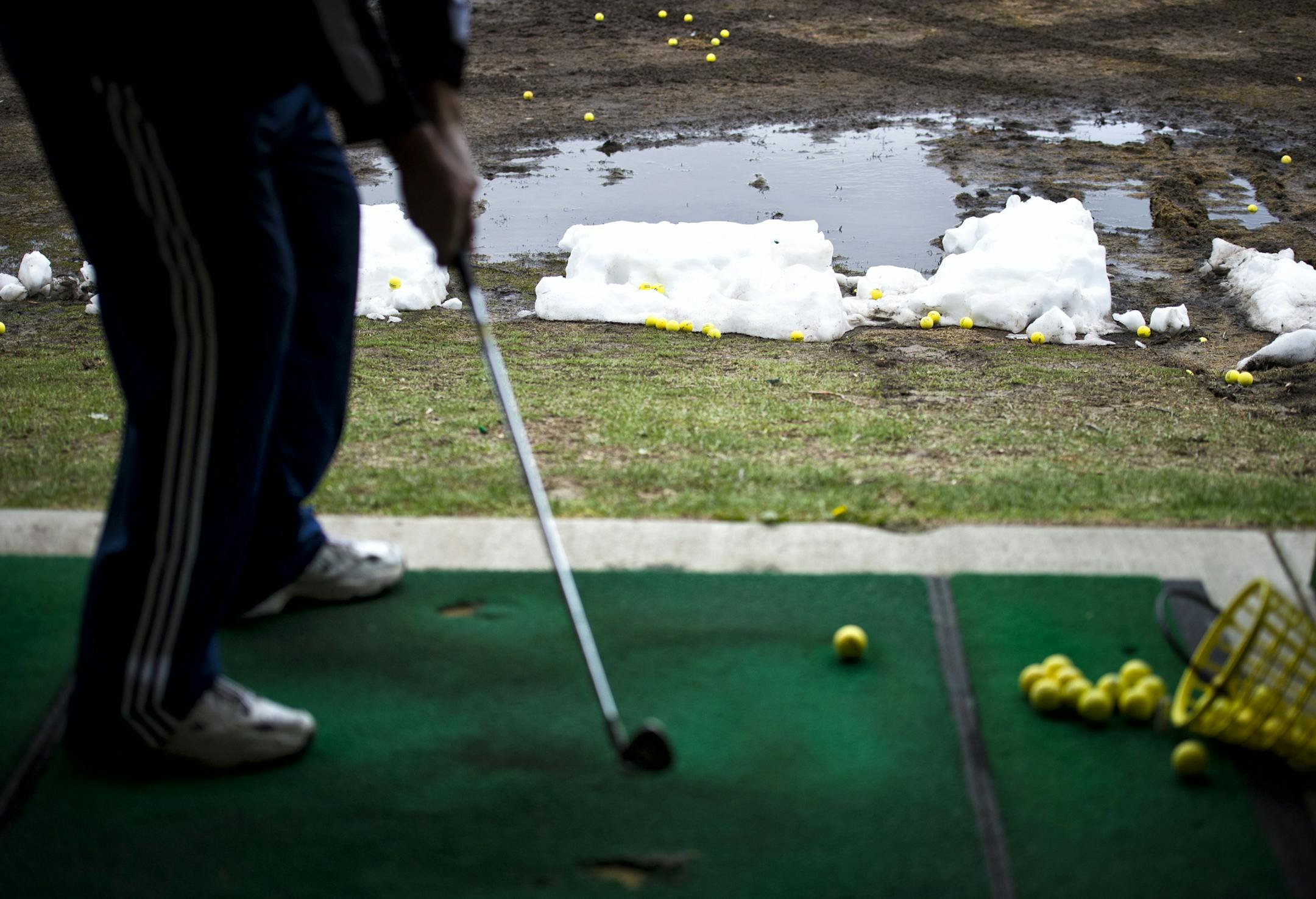 With snow still covering most golf courses in Minnesota into the third week of April, Golf Zone, the year-round heated driving range in Chaska where crews plow the range, was doing a brisk business Monday, April 15, 2013. ] GLEN STUBBE * gstubbe@startribune.com