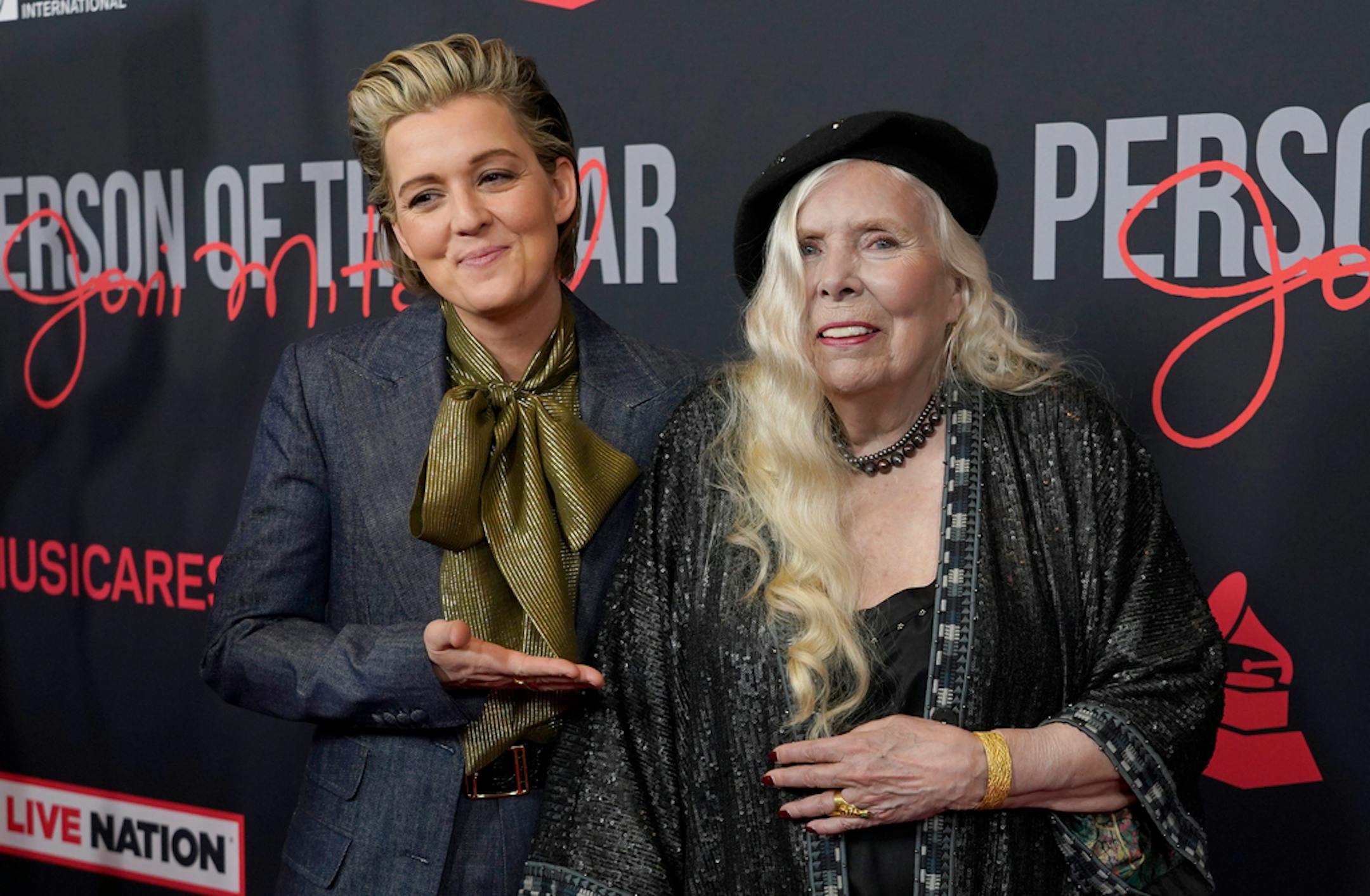 Brandi Carlile, left, and Joni Mitchell arrive at the 31st annual MusiCares Person of the Year benefit gala honoring Mitchell on Friday, April 1, 2022, at the MGM Grand Conference Center in Las Vegas. (AP Photo/Chris Pizzello)