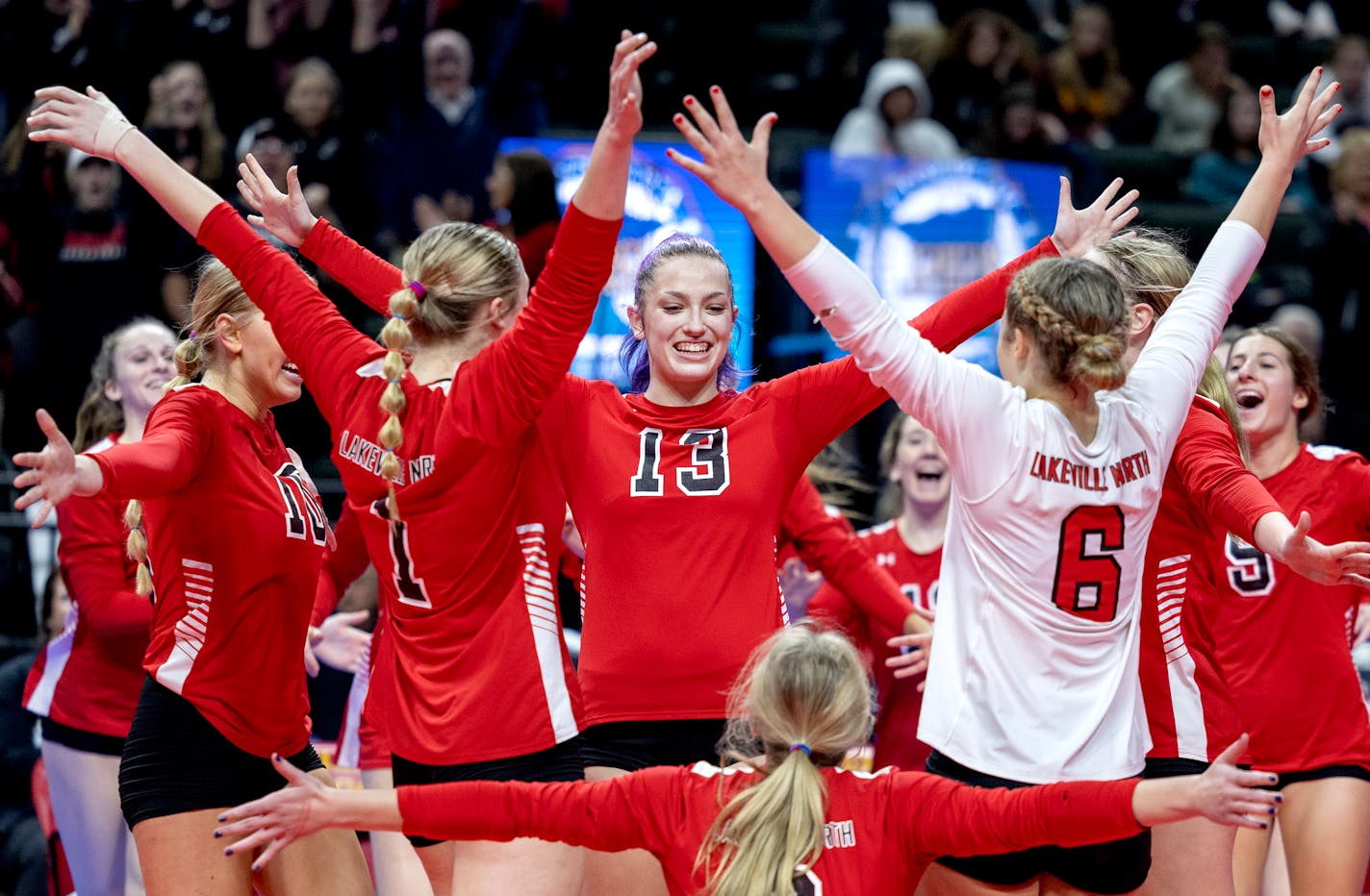 Lakeville North players celebrate after beating East Ridge during the Class 4A volleyball semifinals, Thursday, November 10, 2022, at Xcel Energy Center in St. Paul, Minn. ] CARLOS GONZALEZ • carlos.gonzalez@startribune.com.