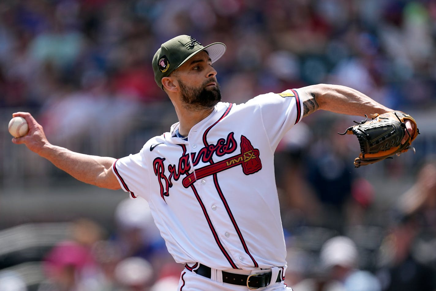 FILE - Atlanta Braves relief pitcher Nick Anderson (61) works in the eighth inning of a baseball game against the Seattle Mariners, Sunday, May 21, 2023, in Atlanta. The Braves jettisoned their third arbitration-eligible player in two days, trading right-hander Nick Anderson to the Kansas City Royals on Friday, Nov. 17, 2023, for cash. (AP Photo/John Bazemore, File)