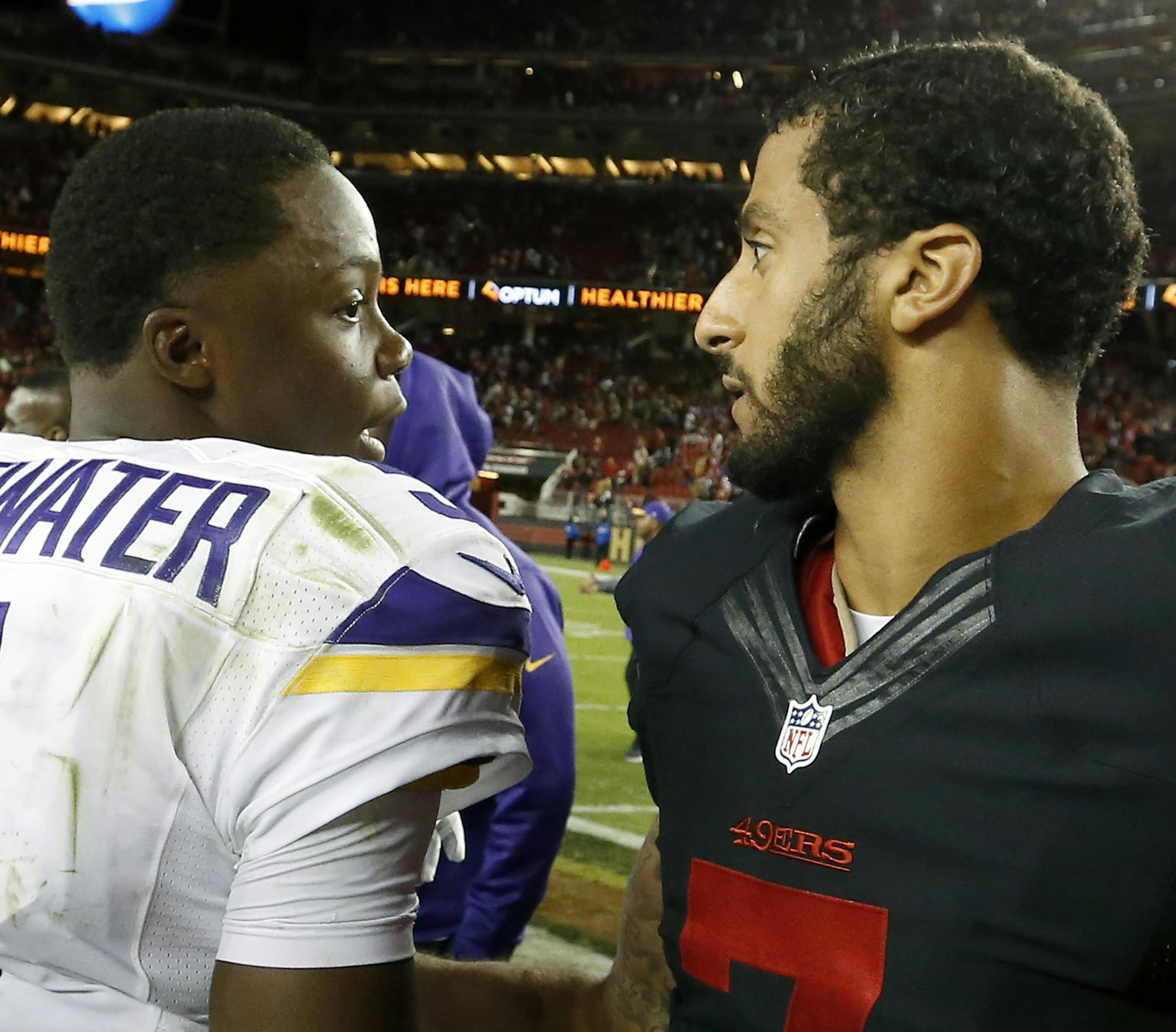 Vikings quarterback Teddy Bridgewater (5) spoke with San Francisco quarterback Colin Kaepernick (7) at the end of the game. ] CARLOS GONZALEZ cgonzalez@startribune.com - September 14, 2015, Levi's Stadium, Santa Clara, CA, NFL, Minnesota Vikings vs. San Francisco 49ers, Monday Night Football