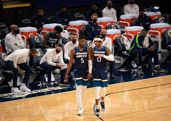 Timberwolves guard D'Angelo Russell (0) spoke with Malik Beasley (5) during a game earlier this month.