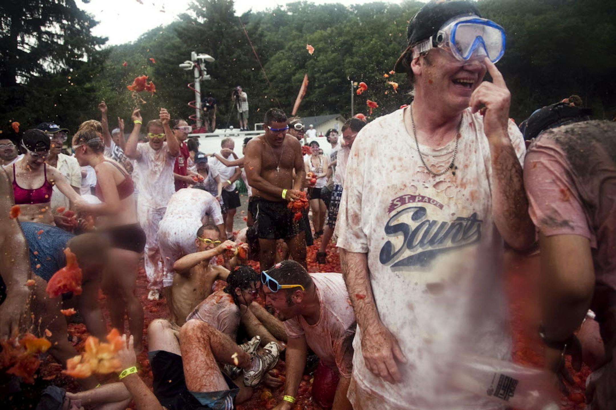 At the first-ever Midwest Tomatofest at Afton Alps, tomatoes were thrown as thousands of people enjoyed live music and mud fights.