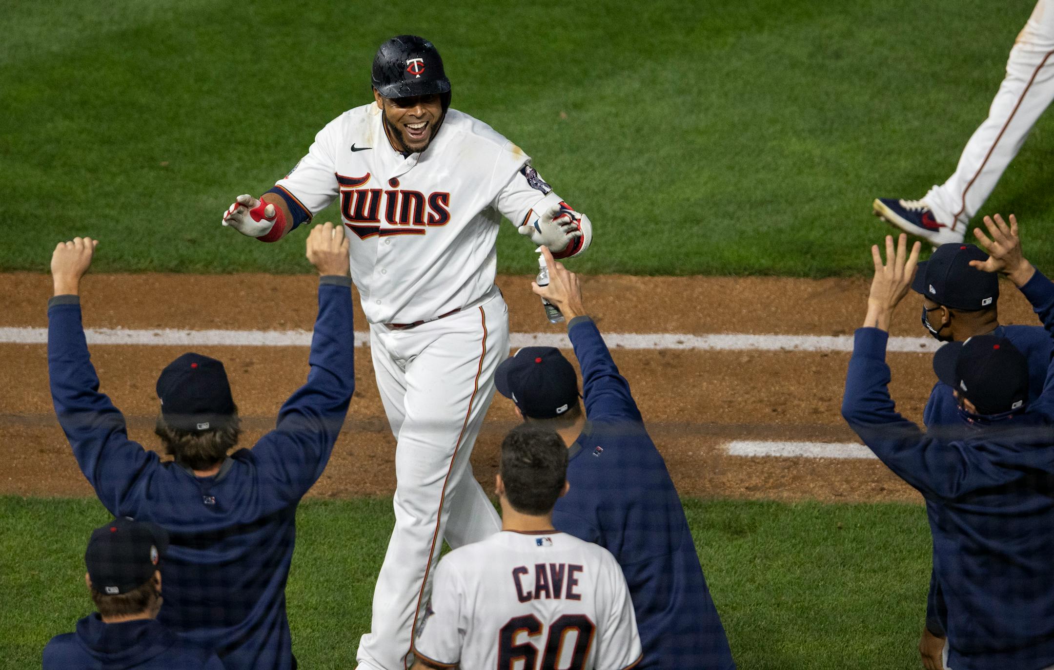 Nelson Cruz was joined in celebration by his Twins teammates after his game-winning single in the ninth inning defeated the Pirates 5-4 at Target Field on Monday night.