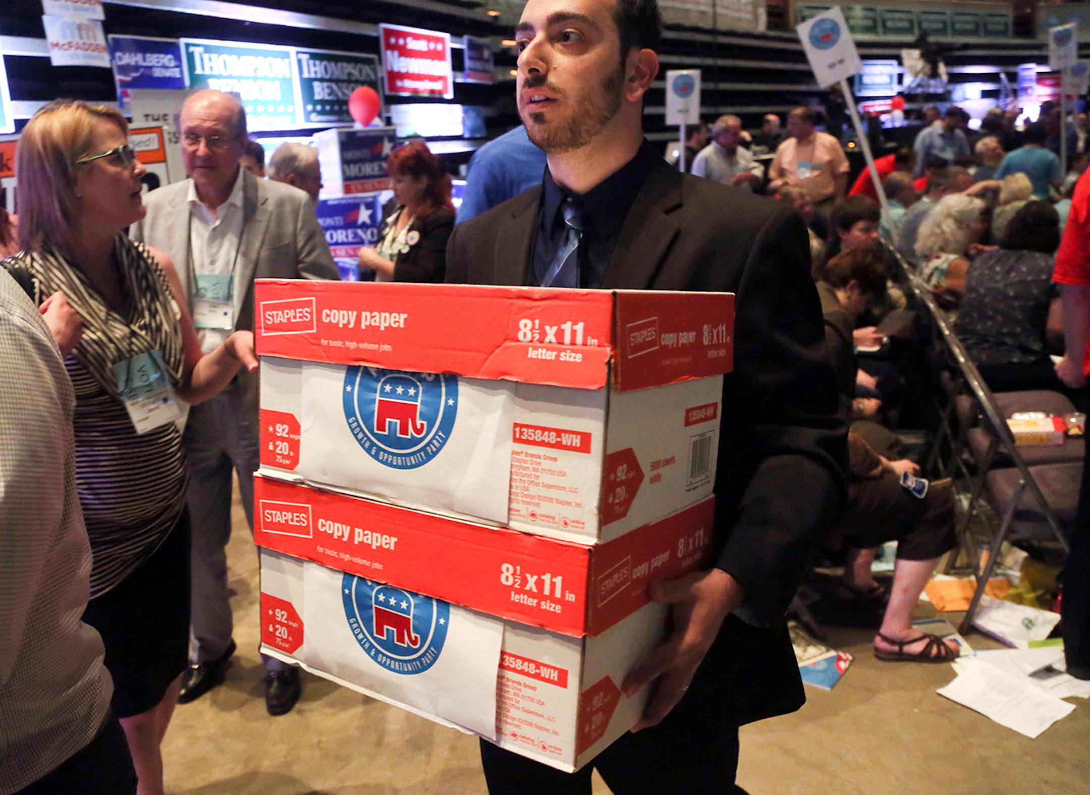 A convention worker carries in boxes filled with the third ballot for the Republican U.S. Senate at the Minnesota Republican Party Convention at the Rochester Civic Center Friday, May 30, 2014.](DAVIDJOLES/STARTRIBUNE) djoles@startribune.com Minnesota Republican Party Convention at the Rochester Civic Center Friday, May 30, 2014