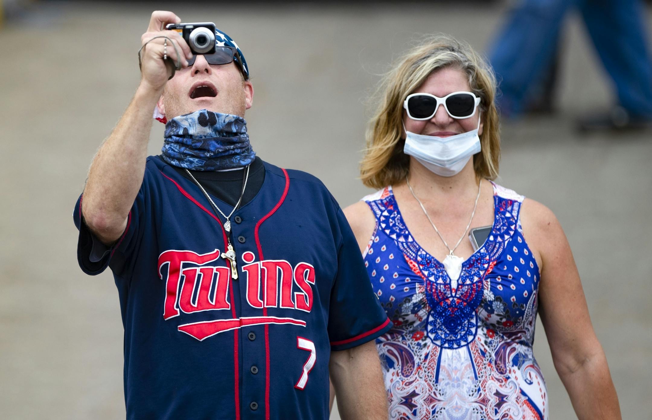 Two Trump supporters took in the scene as they walked into Lake Superior Warehousing to watch Vice President Mike Pence speak in Duluth on Friday.