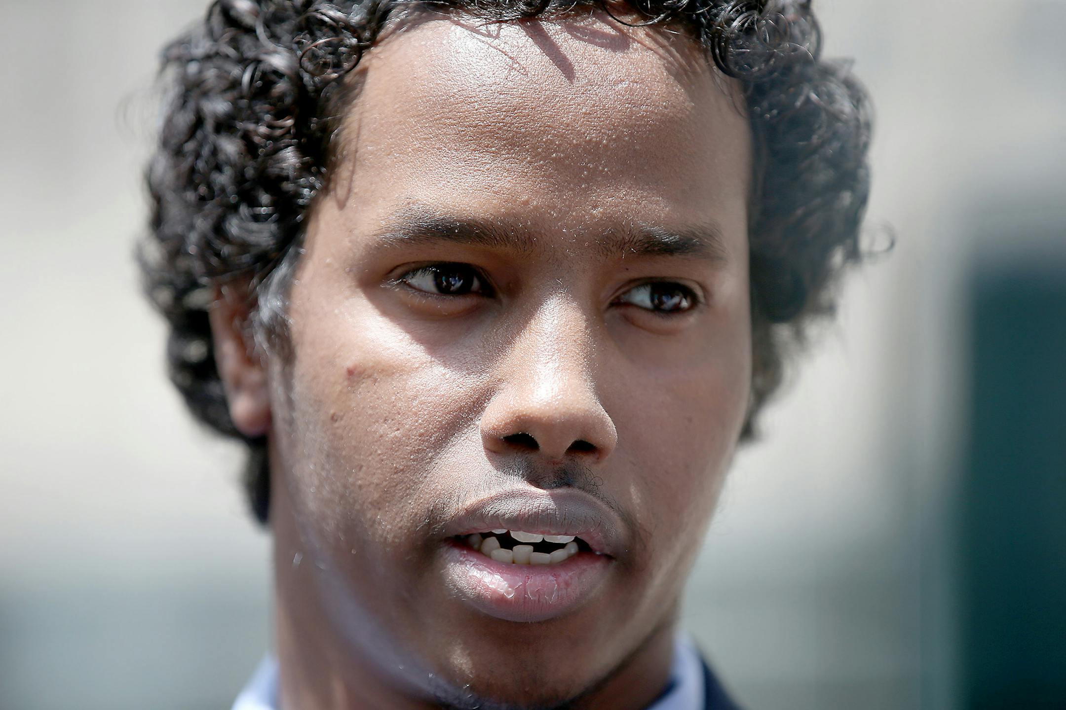 Mohamed Ali Omar speaks outside the federal courthouse, Tuesday, June 9, 2015, in Minneapolis. Omar, convicted of threatening FBI agents who were conducting a terror investigation, was released from custody Tuesday and his sentencing was postponed as a federal judge weighs whether a recent U.S. Supreme Court decision will affect the case. (Elizabeth Flores/Star Tribune via AP)