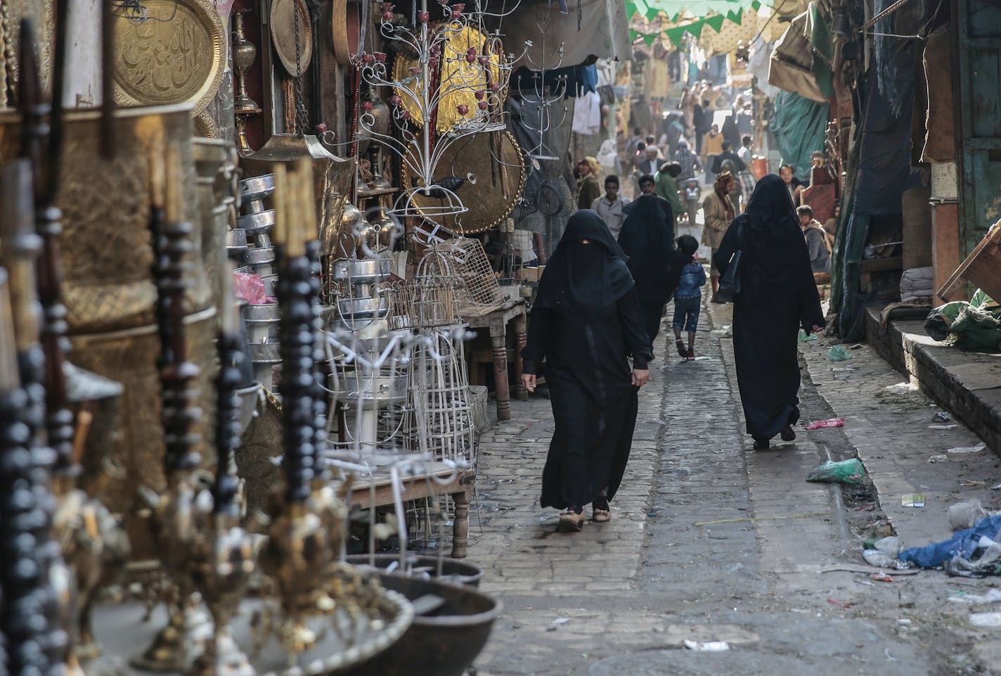 Yemenis walk through market in the old city of Sanaa, Yemen, Tuesday, Dec. 11, 2018. (AP Photo/Hani Mohammed)