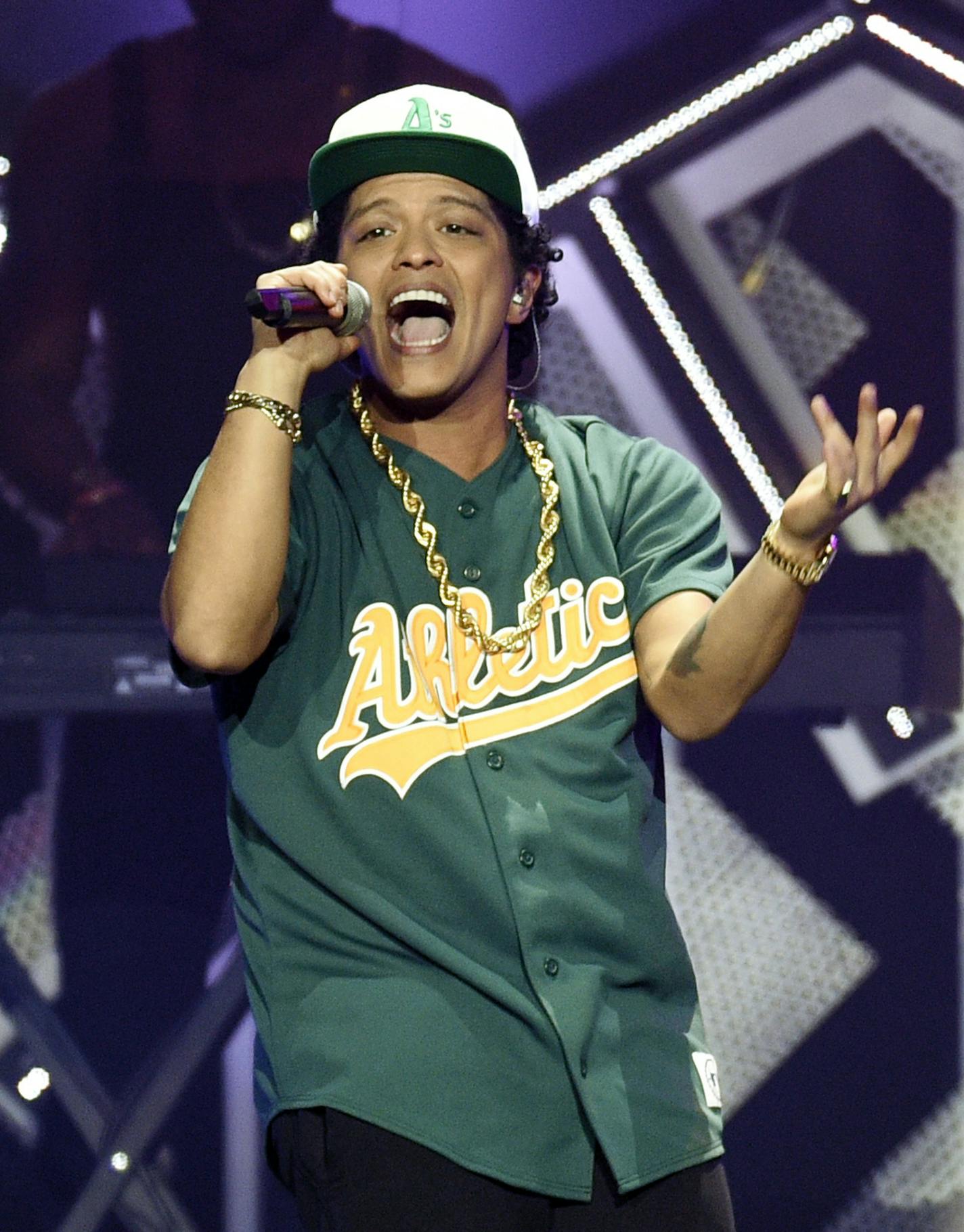 FILE - In this Dec. 2, 2016, file photo, Bruno Mars performs at the 2016 Jingle Ball at Staples Center in Los Angeles. The &#xec;B&#xee; in BET Awards could stand for Beyonce, or Bruno Mars.
Both pop stars are the top nominees at Sunday&#xed;s show, June 25, 2017, where they will compete in four of the same categories, including video of the year. Mars, who will open the show at the Microsoft Theater in Los Angeles, is nominated for five awards. (Photo by Chris Pizzello/Invision/AP, File)