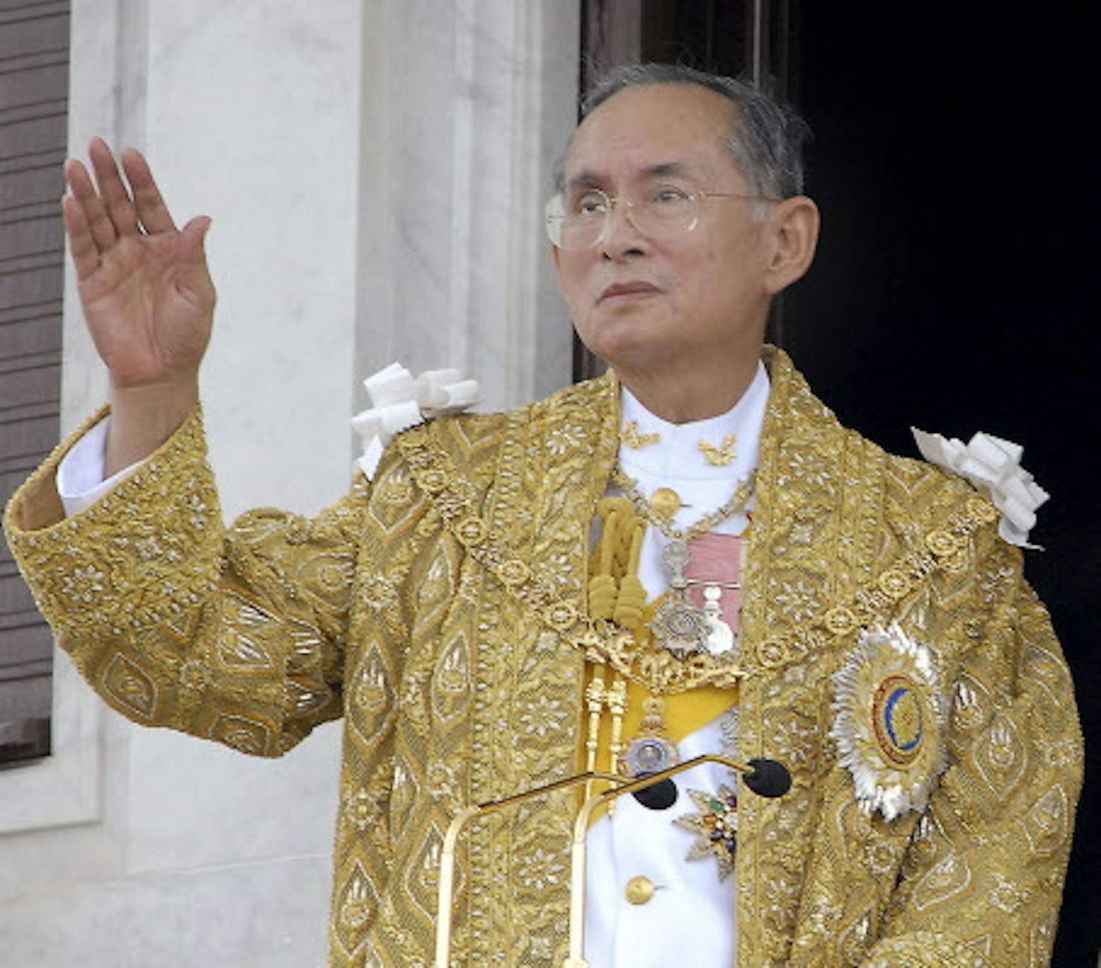 FILE - In this June 9, 2006, file photo released by the Thai Government Public Relations Department, Thailand King Bhumibol Adulyadej acknowledges the crowd in Bangkok during the celebrations of the 60th anniversary of his accession to the throne. (Thai Government Public Relations Department via AP, File)