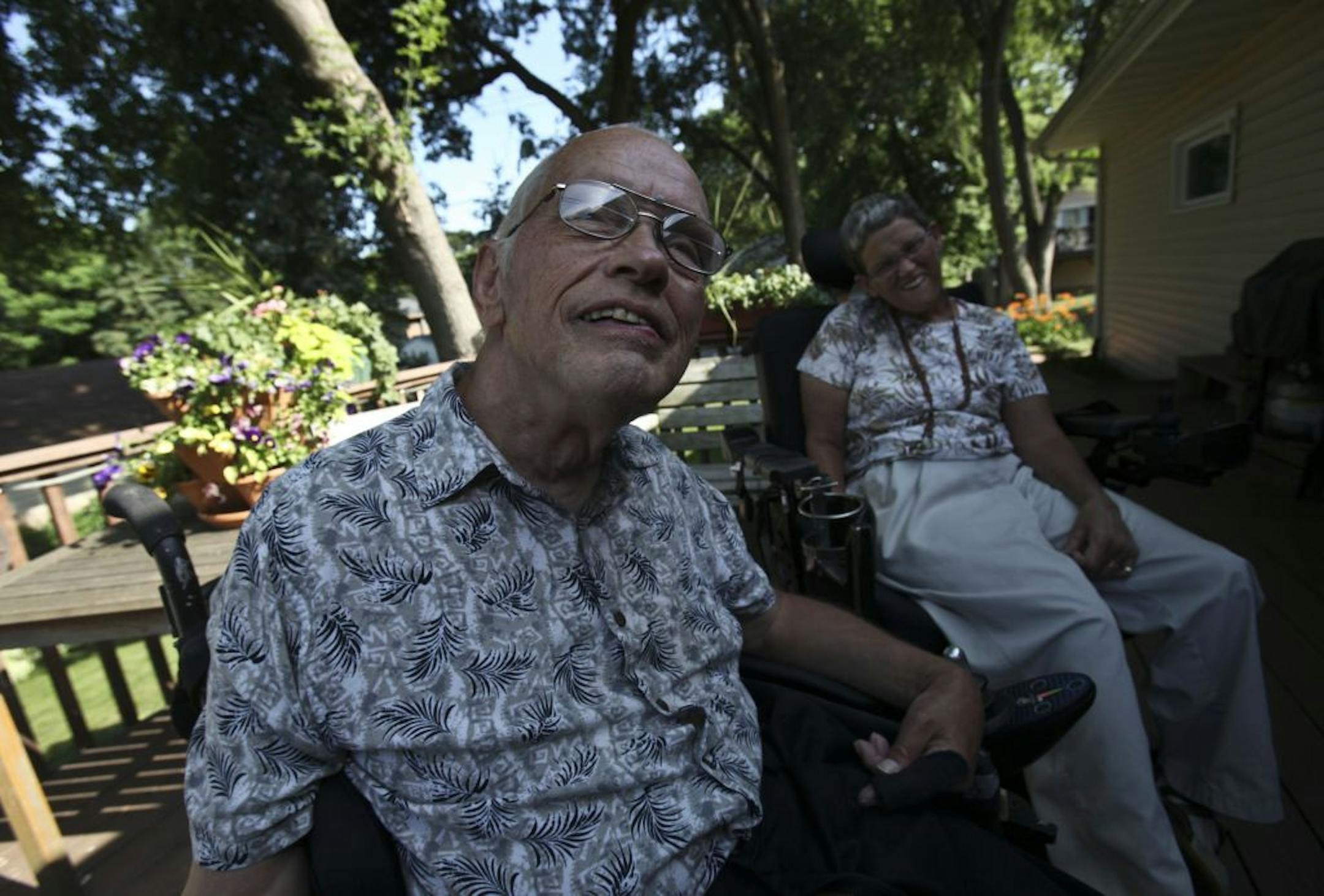 There's no safety net: Jim and Claudia Carlisle sat on the deck of their home in West St. Paul on Wednesday. The Carlisles use personal care assistants because of their disabilities. With the state government shutdown, if one of their personal care assistants quits or has to leave, they can't hire a new person because of the need for background checks. They have no family in the area, so there is no safety net for them.