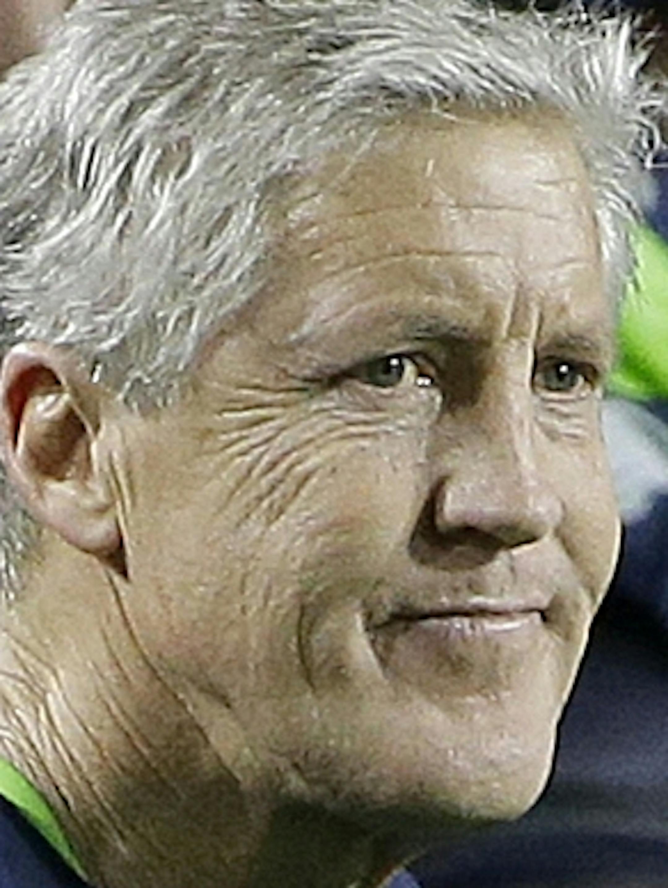 Seattle Seahawks head coach Pete Carroll, center, watches as players react after Russell Wilson was intercepted by New England Patriots strong safety Malcolm Butler during the second half of NFL Super Bowl XLIX football game Sunday, Feb. 1, 2015, in Glendale, Ariz. (AP Photo/Matt Rourke)