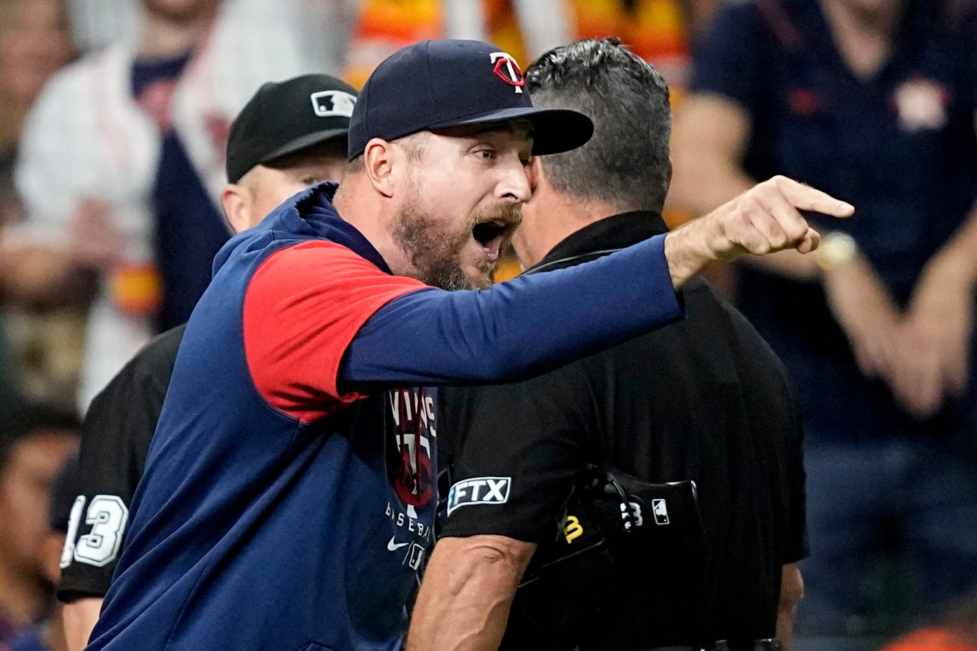 Minnesota Twins manager Rocco Baldelli argues with umpires during the fifth inning of a baseball game against the Houston Astros Tuesday, Aug. 23, 2022, in Houston. Baldelli was ejected from the game. (AP Photo/David J. Phillip)