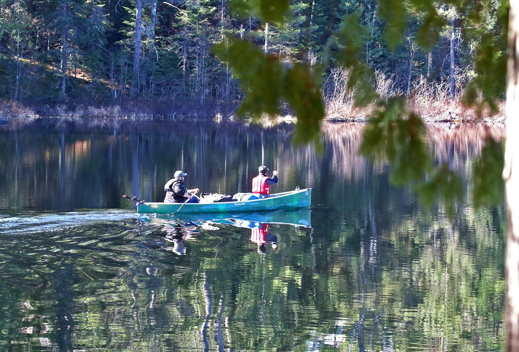 Aaron Youngblom, left, and Carson Spohn, both of Duluth, paddle into Quetico Provincial Park just after the ice went out in late April.
