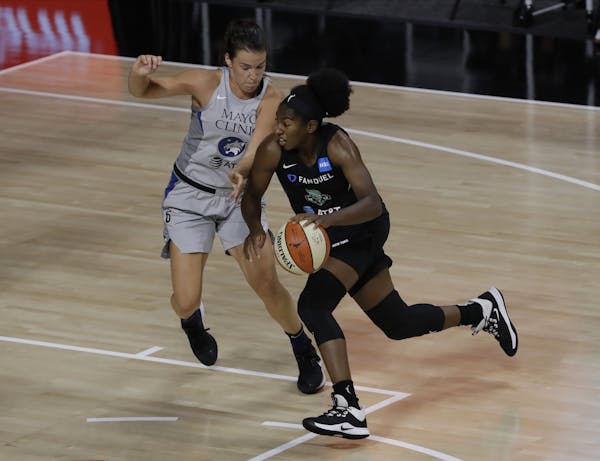 New York Liberty guard Jocelyn Willoughby (13) drives arund Minnesota Lynx guard Bridget Carleton during the first half of a WNBA basketball game Wedn