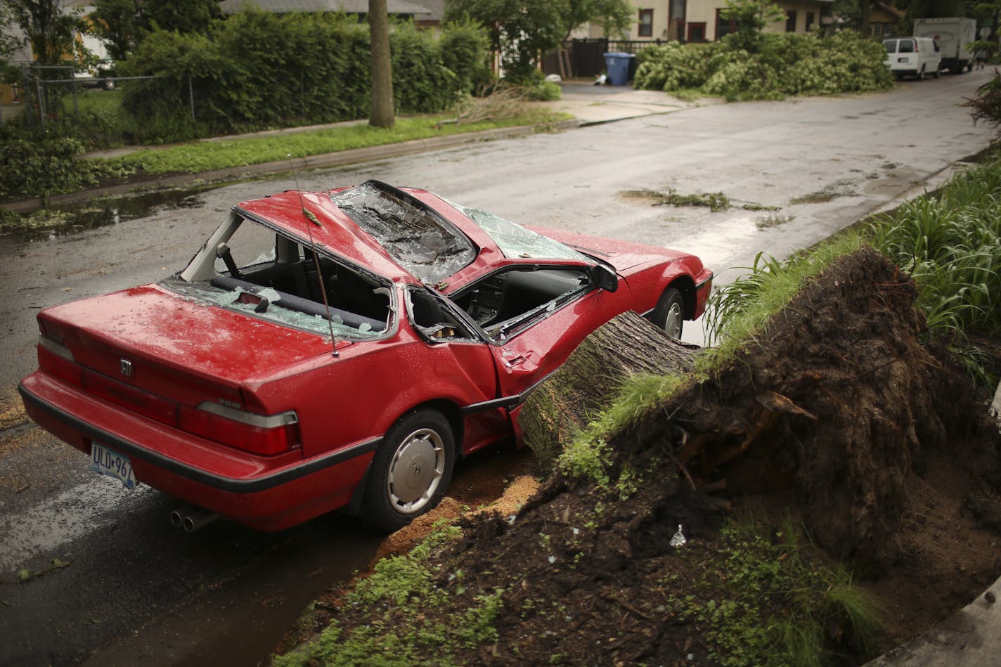 Minneapolis Mayor R.T. Rybak took to the streets of south Minneapolis Monday afternoon, June 24, 2013 to assess damage in some of the neighborhoods hit hardest by the recent storm. A common scene in south Minneapolis, in this case on E 41st St. and 24th Ave. S., where Mayor R.T. Rybak stopped to talk to neighborhood residents about the storm damage to their part of the city. ] JEFF WHEELER &#x201a;&#xc4;&#xa2; jeff.wheeler@startribune.com