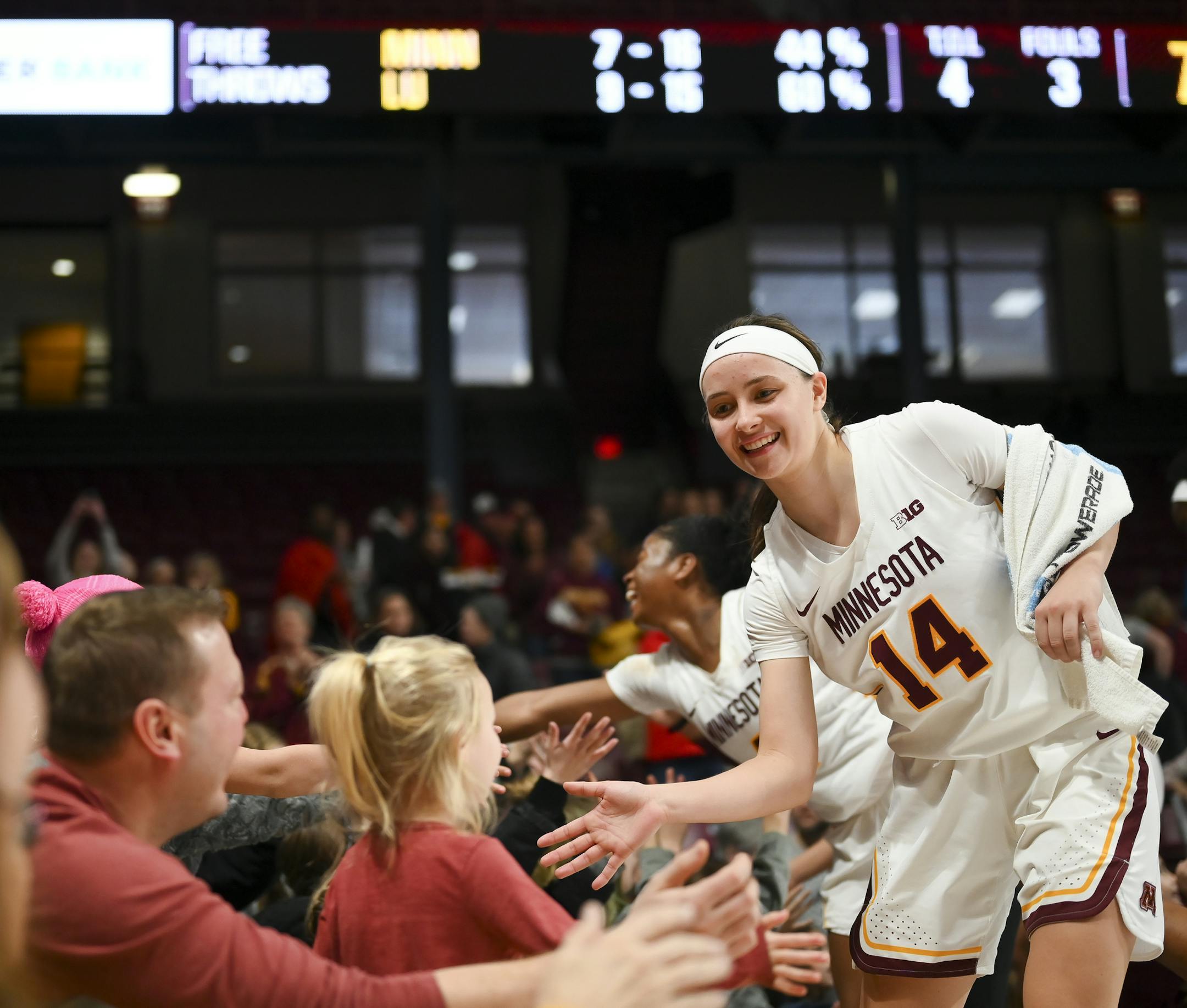 Minnesota Gophers guard Sara Scalia (14) high fived fans after hear team's 77-49 win against the Lehigh Mountain Hawks. ] Aaron Lavinsky • aaron.lavinsky@startribune.com The Minnesota Gophers played the LeHigh Mountain Hawks on Saturday, Dec. 21, 2019 at Williams Arena in Minneapolis, Minn.