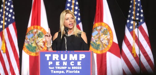 Florida Attorney General Pam Bondi speaks to Donald Trump supporters during a campaign rally at the Entertainment Hall at the Florida State Fairgrounds in Tampa, Wednesday, Aug. 24, 2016. (Octavio Jones/Tampa Bay Times via AP) ORG XMIT: MIN2016090914512016