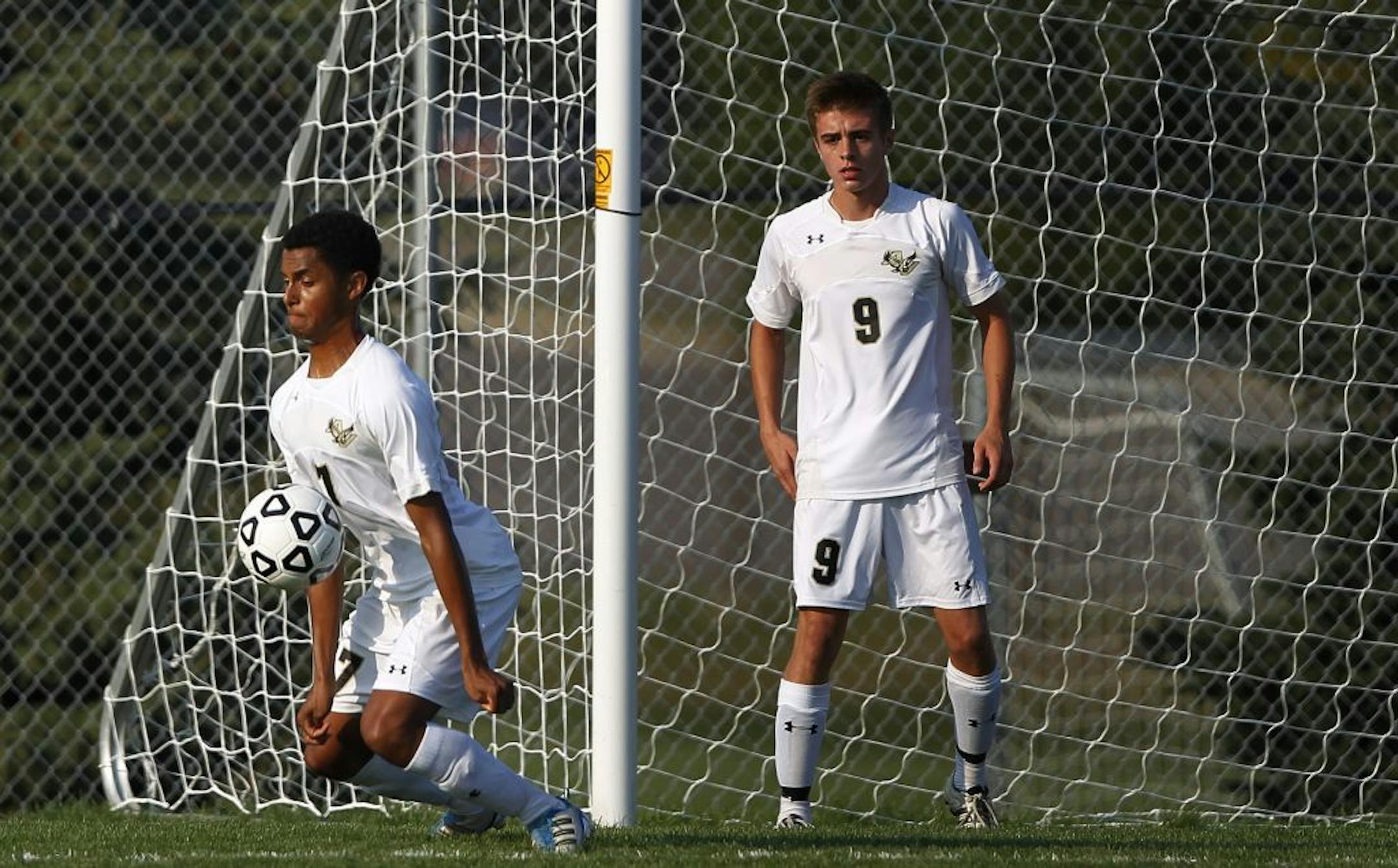 Apple Valley defenseman Jordan Charles made a stop in front of goalkeeper Avery Veldhouse during the Eagles' recent victory over Bloomington Kennedy. The Eagles started the season 6-0. Photo by Jerry Holt • jholt@startribune.com