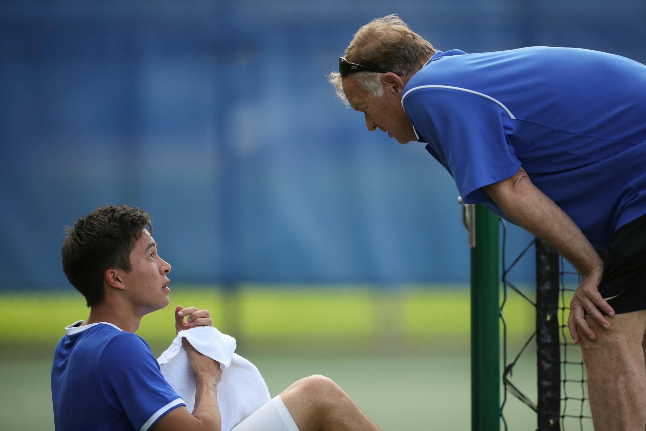 Defending Class 1A singles champion Jack Barker talked to Blake coach Ted Warner during a recent match. The Bears also are the defending Class 1A team champions.