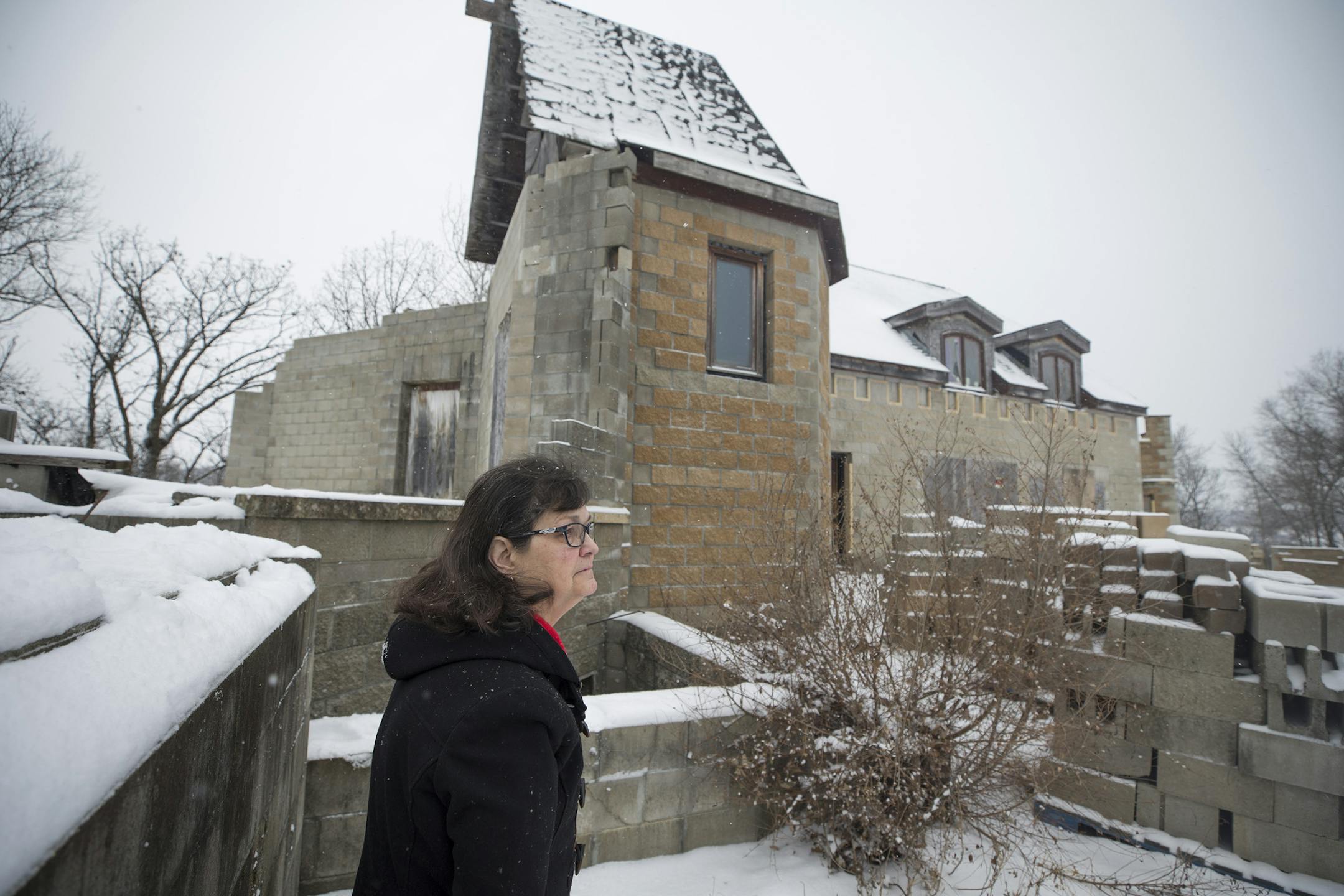 Beth Arntson stood outside of a dream castle that she and her husband Gary Arntson started to build themselves 20 years ago. Because of an illness to her husband they are selling their castle.