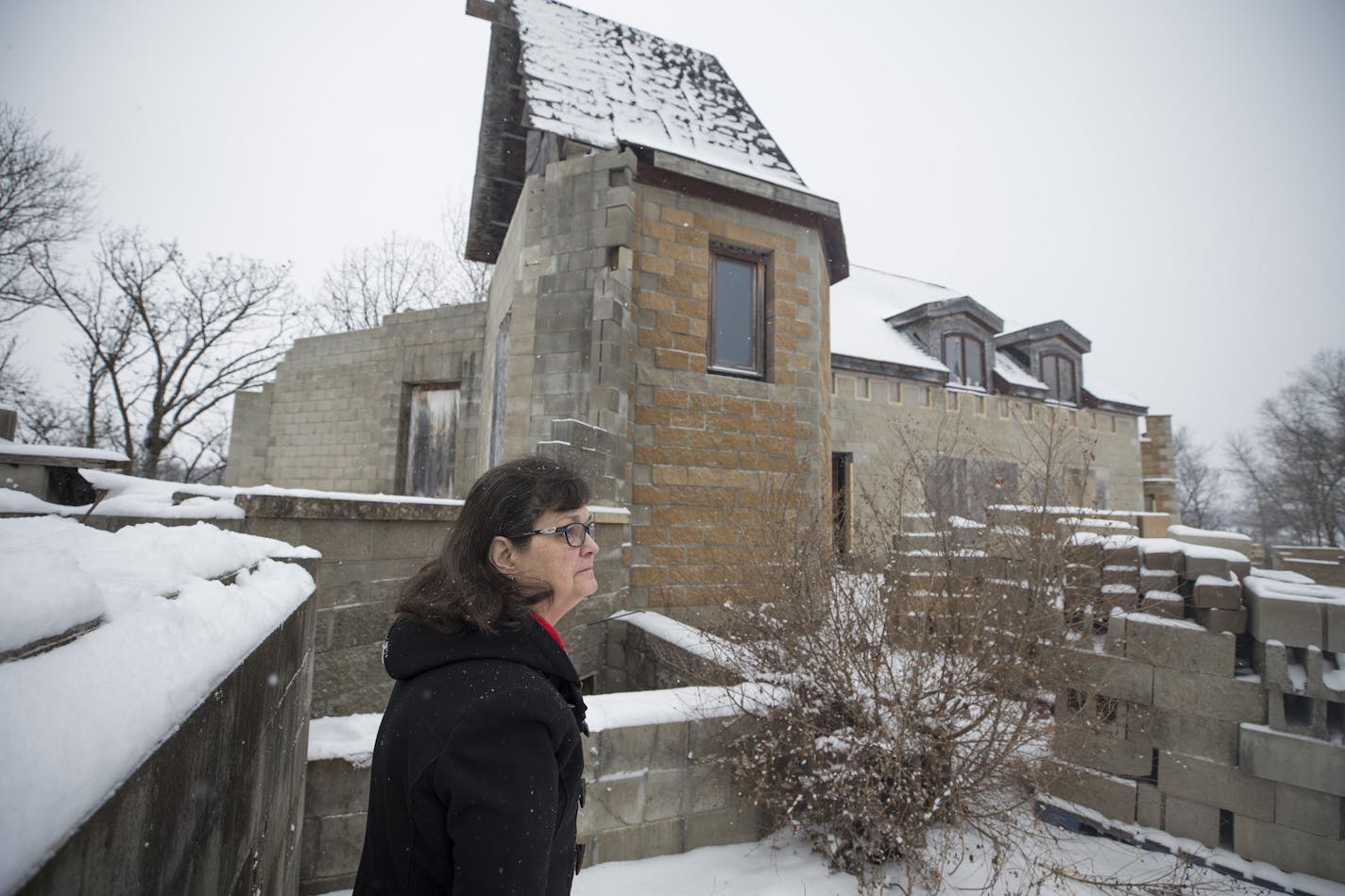 Beth Arntson stood outside of a dream castle that she and her husband Gary Arntson started to build themselves 20 years ago. Because of an illness to her husband they are selling their castle.