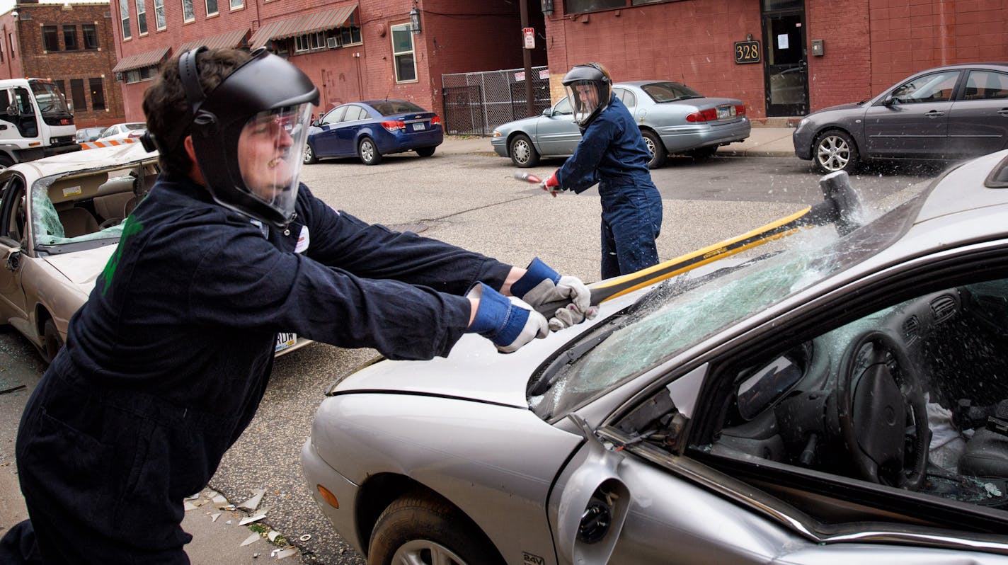 Matt Cummings and Emily Dusold of Anchor Paper in St. Paul smashed a car as part of Give to the Max Day. ] GLEN STUBBE * gstubbe@startribune.com Thursday, November 17, 2016 Spare Key partnered with The Break Room and held a Smash to the Max fundraiser for the 8th annual Give to the Max Day. People paid $20 to smash and destroy objects for 5 minutes with sledgehammers and baseball bats. Spare Key helps critically ill or seriously injured children by providing a housing grant for their parents so