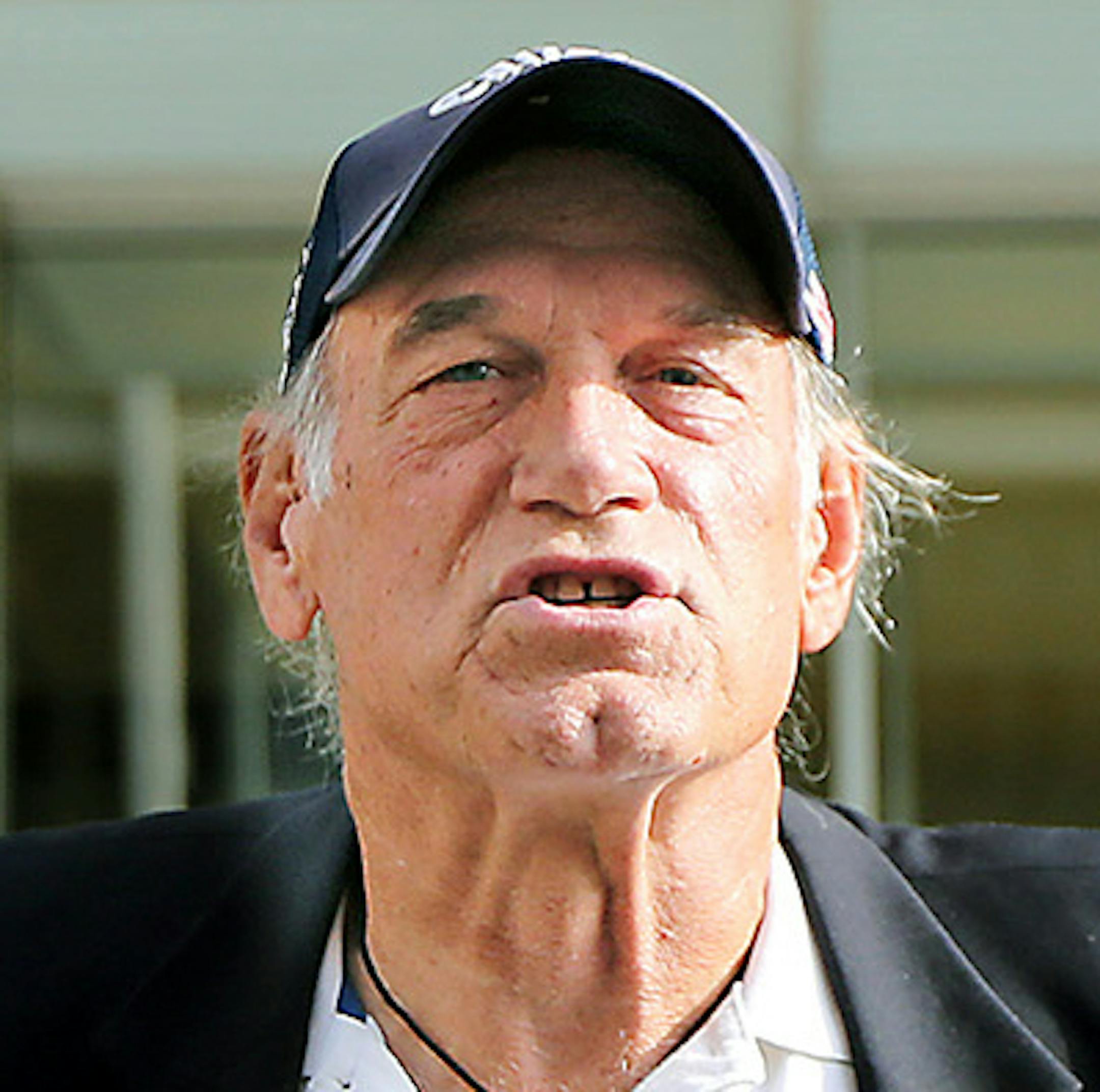 Former Minnesota Gov. Jesse Ventura talks to reporters at the Warren E. Burger Federal Building and United States Courthouse after a defamation hearing, Tuesday, Oct. 20, 2015, in St. Paul, Minn. An attorney for the estate of slain "American Sniper" author Chris Kyle has asked a federal appeals court to overturn a $1.8 million defamation judgment for Ventura. Ventura accused Kyle of making up a story in his book about punching Ventura at a bar in 2006 after Ventura supposedly made offensive rema