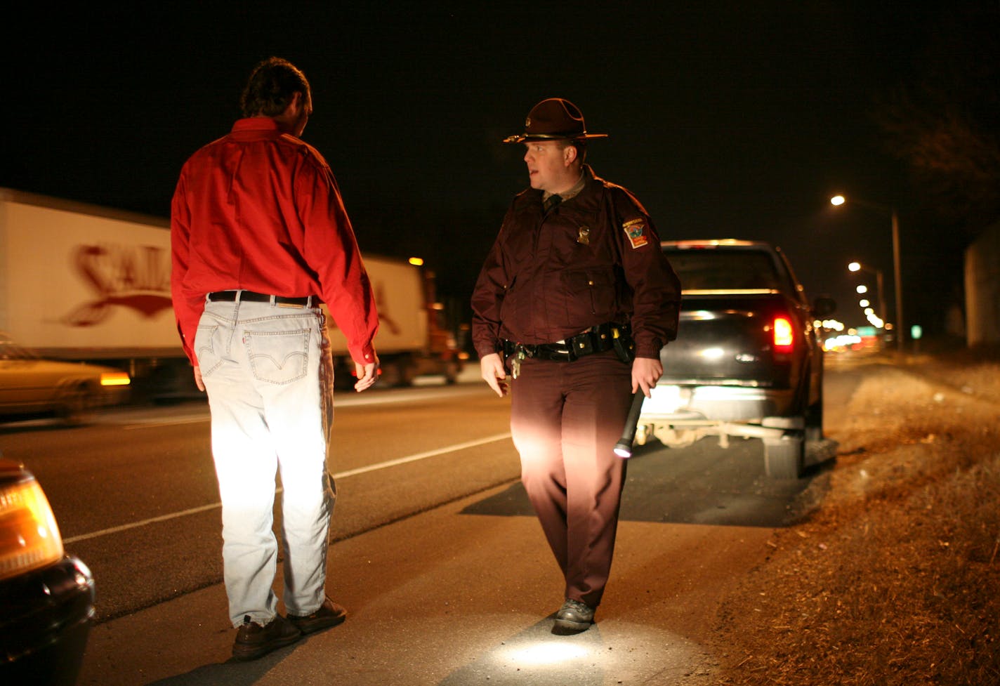 In this file photo, Trooper Adam Flynn stopped a driver for following behind another vehicle too closely on I-35W. He then asked him to perform a field sobriety test, which he passed.