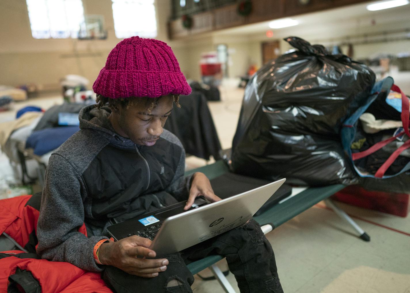 Jeremiah Kennedy 19, spent Wednesday morning packing. He has lived with his mom Tonieh Richards and his two brothers in the shelter at First Covenant Church since the Christmas day fire at the Drake Hotel .] Jerry Holt &#x2022; Jerry.Holt@startribune.com The temporary shelter at the First Covenant Church served its last meal for Drake Hotel residents at noon Wednesday, Jan. 22, and close at roughly 1p.m Wednesday January 22, 2020 in Minneapolis ,MN.