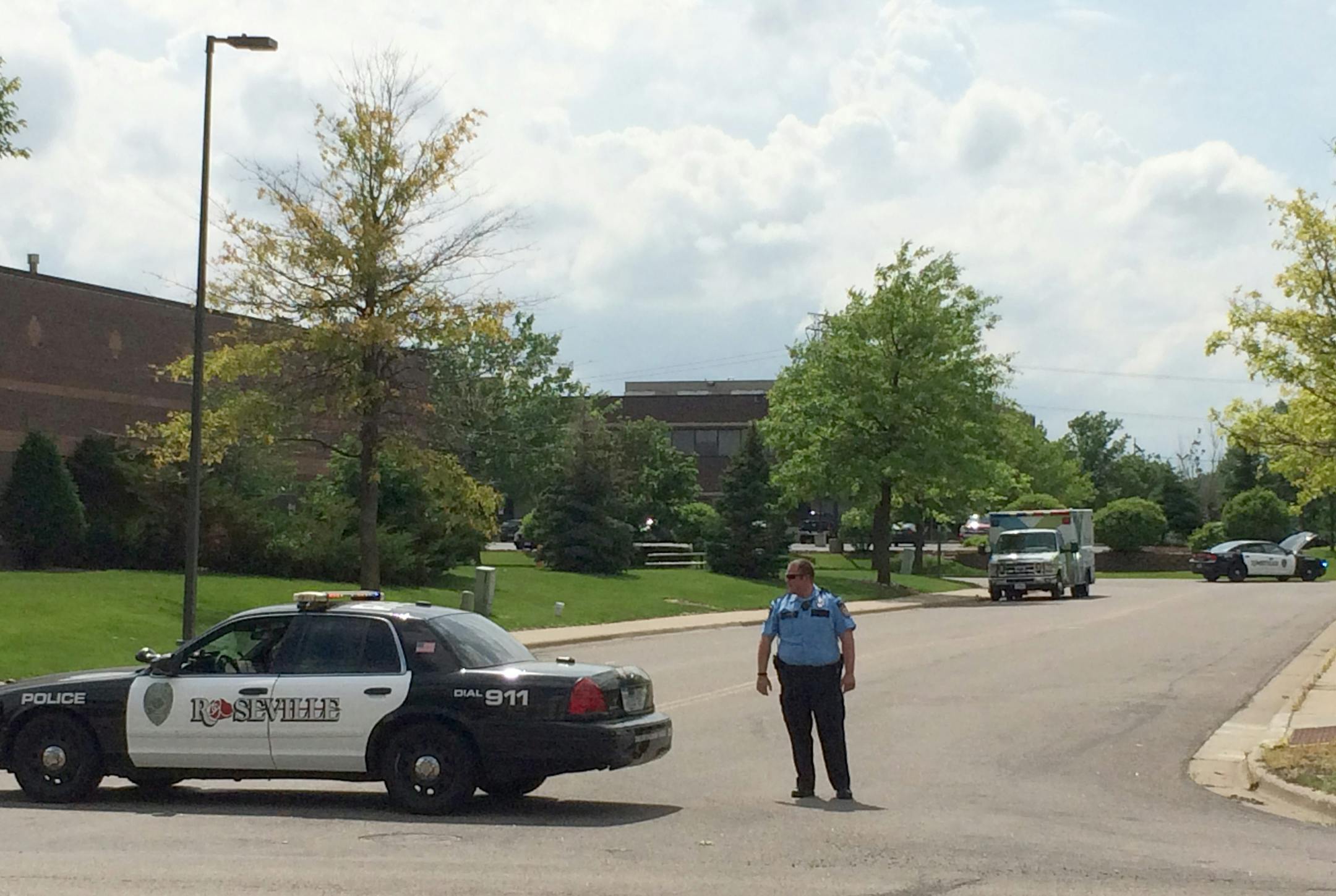 Police block of a street in Roseville after reports of an armed gunman forced the evacuation of an office building Friday, June 27, 2014.
