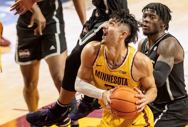 Dawson Garcia was fouled while going to the basket against Mississippi State. He led the Gophers with 20 points in a 69-51 loss on Sunday. 