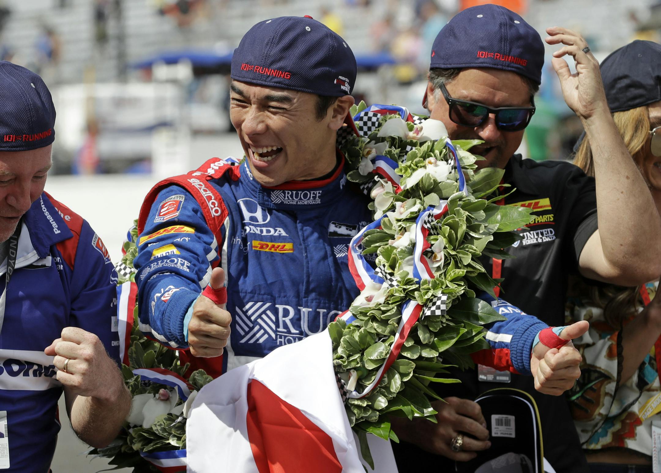 Takuma Sato, of Japan, celebrates on the Yard of Bricks on the start/finish line after winning the Indianapolis 500 auto race at Indianapolis Motor Speedway, Sunday, May 28, 2017 in Indianapolis.(AP Photo/R Brent Smith)
