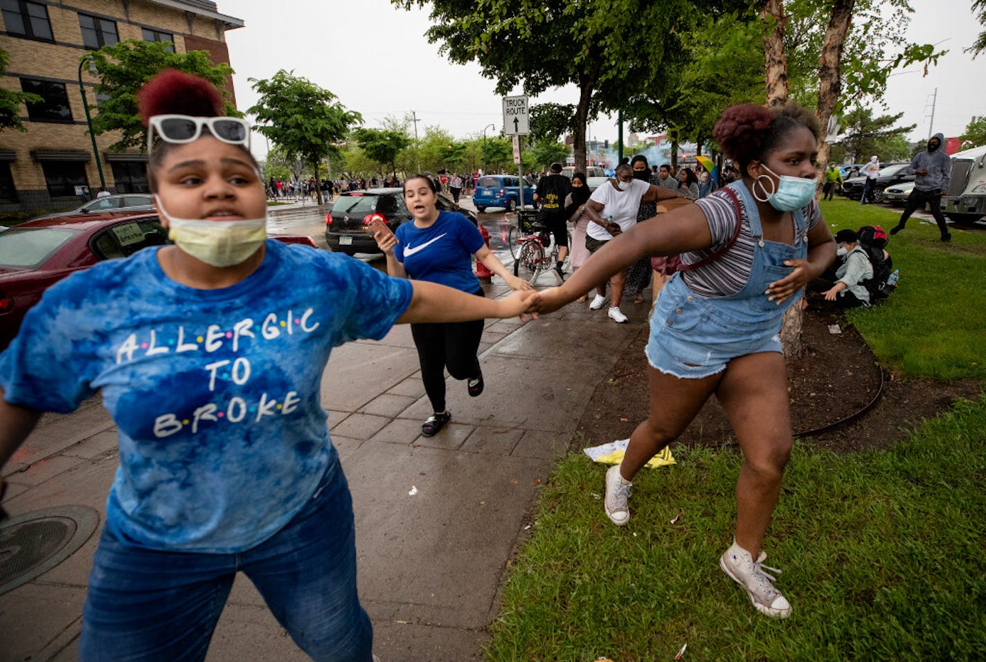 The scene at the Minneapolis 3rd Police Precinct on Tuesday night as protesters ran from percussion grenades and chemical irritant.