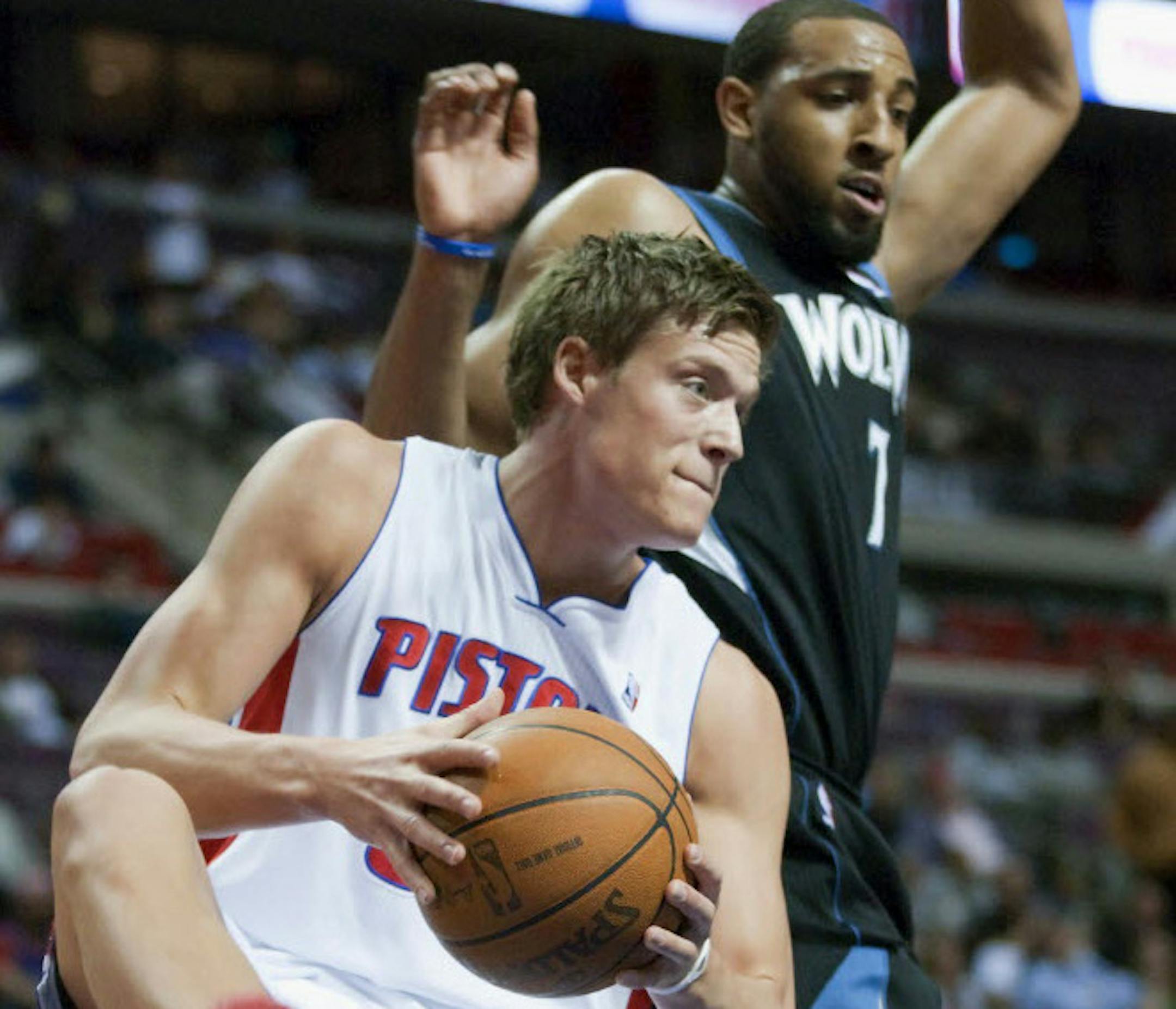 Detroit's Jonas Jerebko pulled down a rebound in front of the Wolves' Derrick Williams.