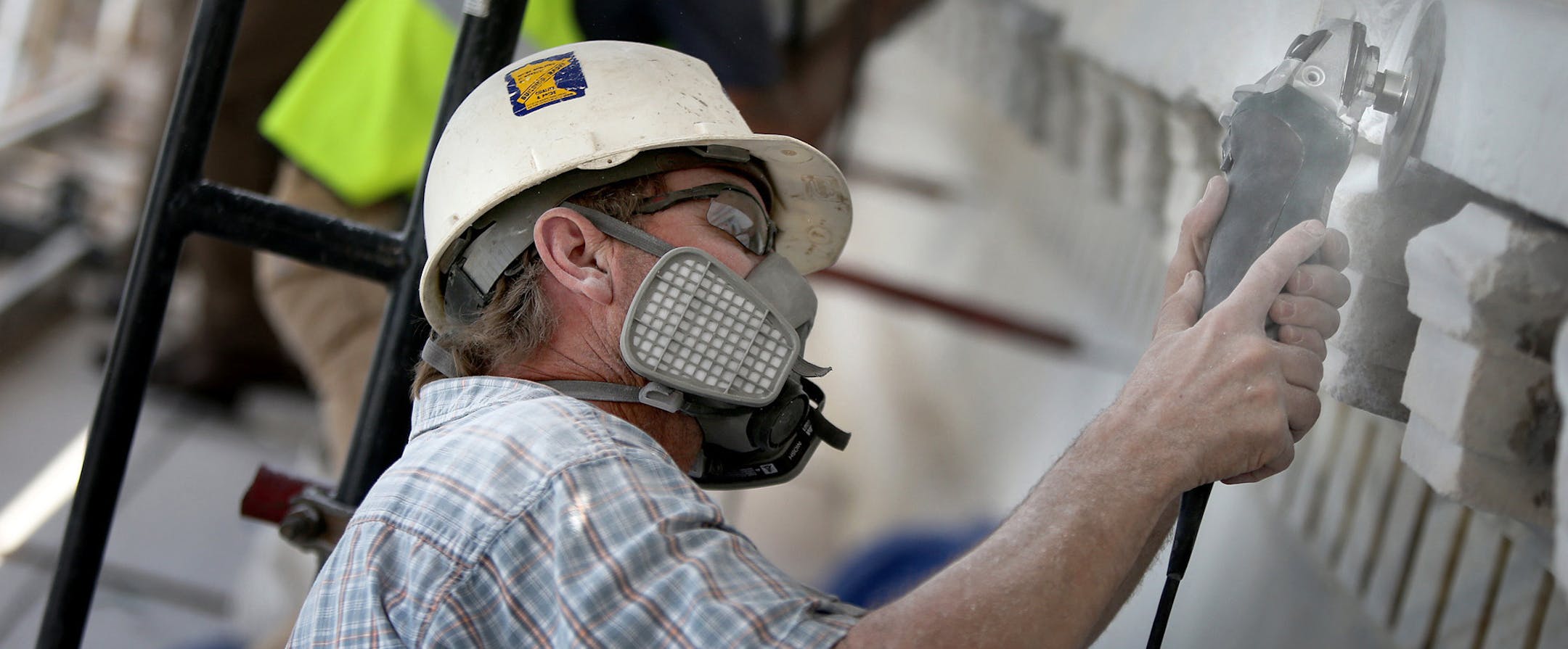 Rory Raebel, cq, worked on the finishing part of the stone at the State Capitol Wednesday, July 10, 2013 in St. Paul, MN. (ELIZABETH FLORES/STAR TRIBUNE) ELIZABETH FLORES ¬• eflores@startribune.com ORG XMIT: MIN1307101321173663