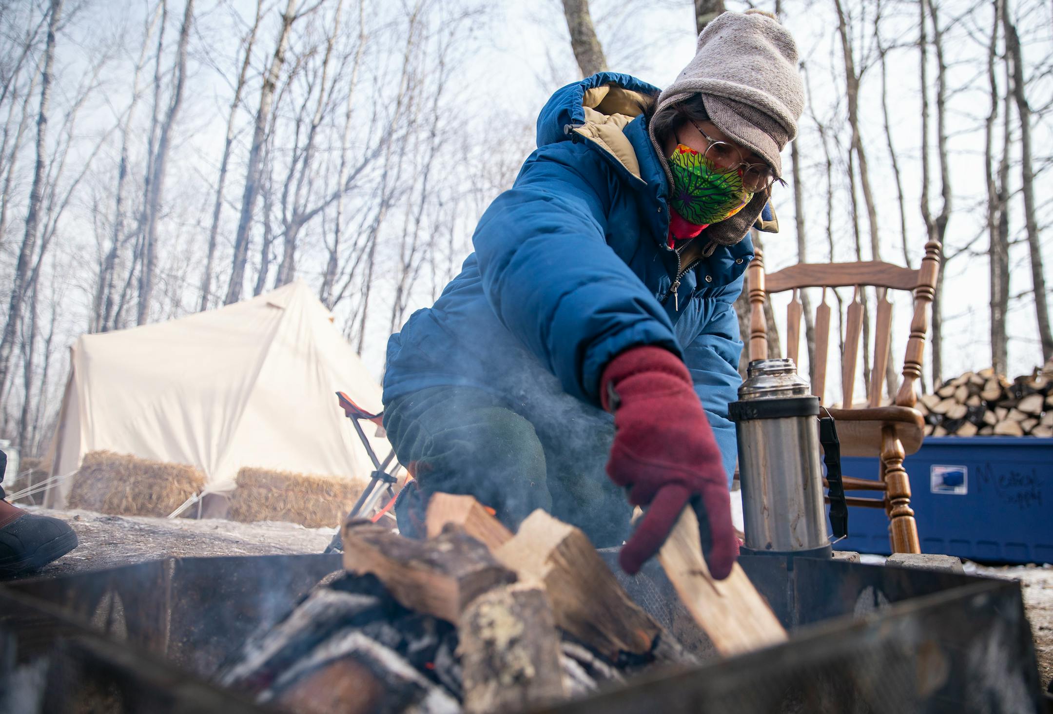 Alex Golden-Wolf walked worked on keeping the fire going inside Camp Migizi. Migizi is a small encampment of mostly indigenous water and land protectors located right beside the Enbridge Line 3 construction site on the Fond Du Lac Native American reservation in Cloquet.