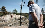 Bruce Kerfoot, owner of the Gunflint Lodge, surveyed the charred remains of a home after the 2007 fire.