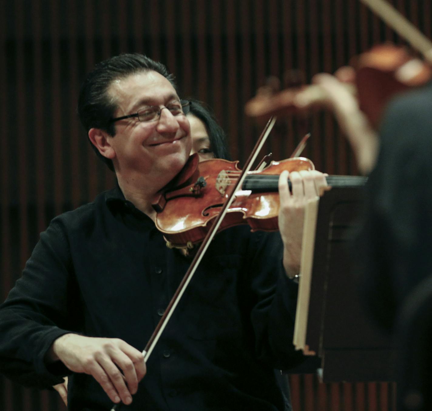 Associate Concertmaster Ruggero Allifranchini seemed to be pleased during the Saint Paul Chamber Orchestra's first rehearsal in the Ordway's nearly completed new concert hall, a space designed specifically for the more intimate acoustic needs of a chamber orchestra and its audience. The hall is a project of the Arts Partnership, comprising the Ordway, SPCO, Schubert Club and Minnesota Opera. ] BRIAN PETERSON &#xe2;&#x20ac;&#xa2; brianp@startribune.com St. Paul, MN - 12/10/2012