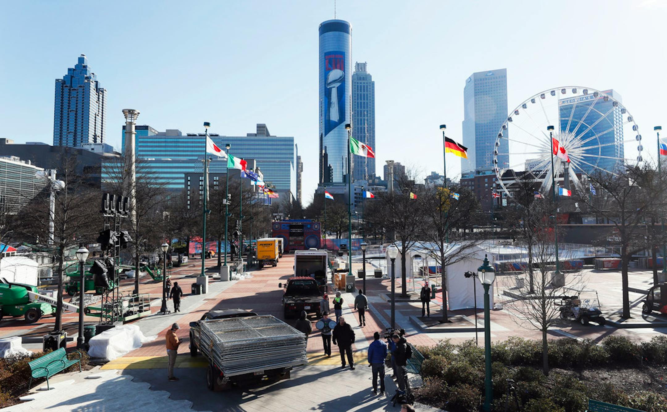 People work in Centennial Park in Atlanta as the city gets ready to host the Super Bowl 53 NFL football game, Friday, Jan. 25, 2019. (Bob AndresAtlanta Journal-Constitution via AP)/