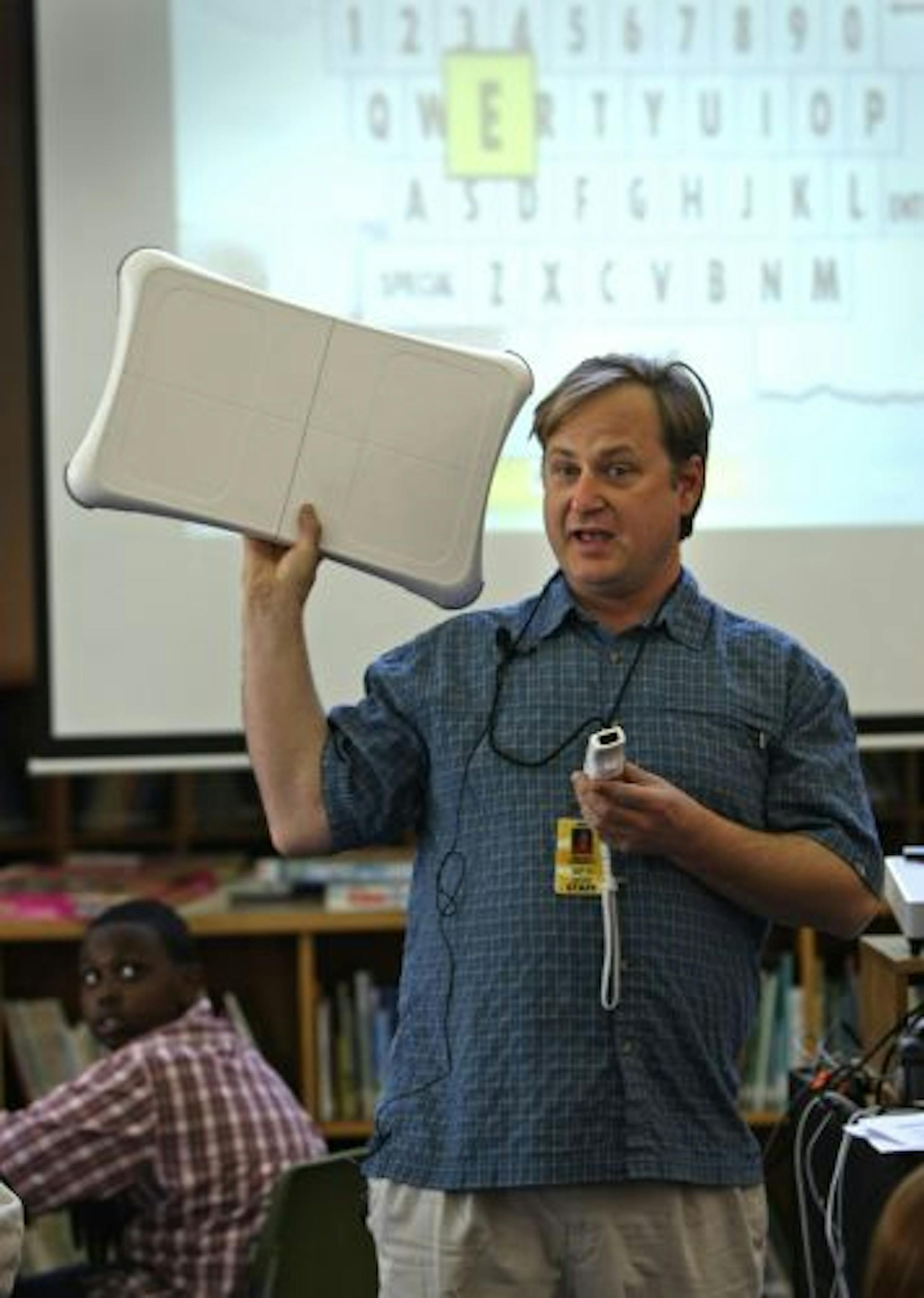 Seward Montessori School Teacher Brock Dubbels explained the Wii video game to his students during his class that uses video games as a learning tool.