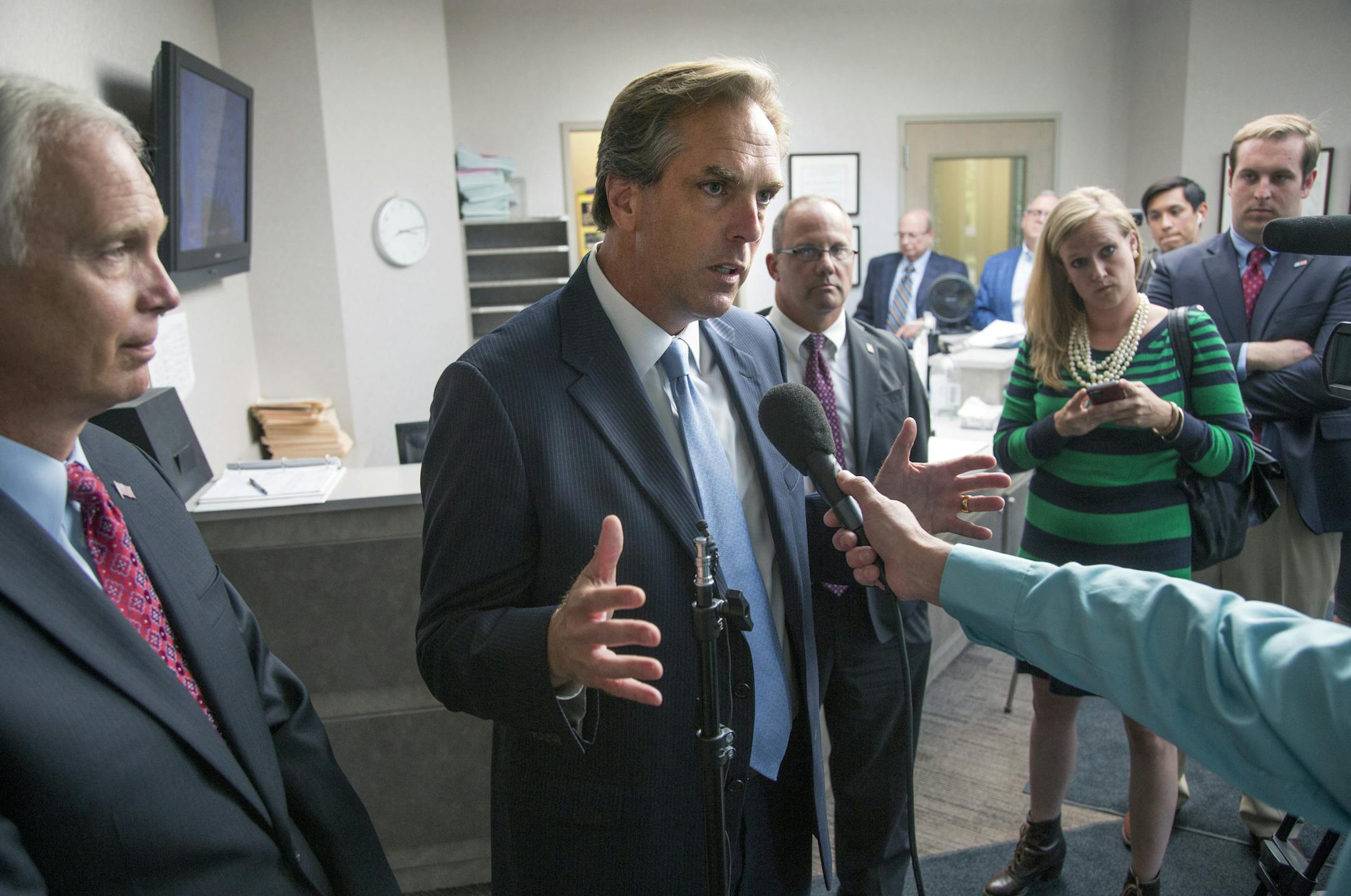 The day after he secured the endorsements of top Independence Party players, Senate candidate Mike McFadden (center) is on the trail with Wisconsin Sen. Ron Johnson (left), a businessman who won his seat under the same premise as McFadden campaigns--by campaigning as a political blank slate. Here, McFadden talks with reporters at Twin City Fan & Blower in Plymouth. ] BRIAN PETERSON ‚Ä¢ brian.peterson@startribune.com Plymouth, MN 09/02/14