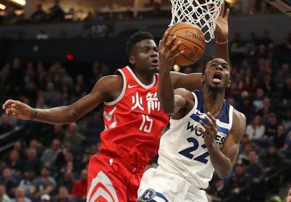 Minnesota Timberwolves forward Andrew Wiggins (22) tried to score over Houston Rockets center Clint Capela (15) in the first half at Target Center Tue