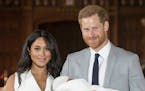 Britain's Prince Harry and Meghan, Duchess of Sussex, during a photocall with their newborn son, in St George's Hall at Windsor Castle, Windsor, south