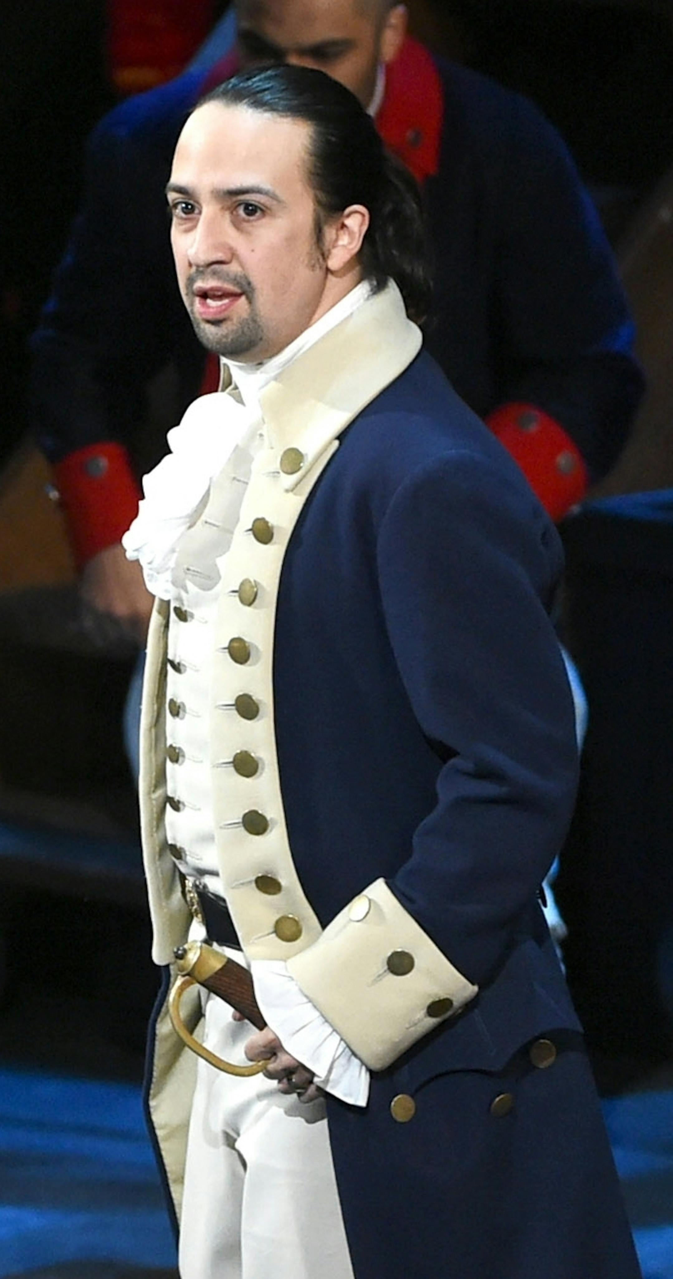 FILE - In this June 12, 2016 file photo, Lin-Manuel Miranda and the cast of "Hamilton" perform at the Tony Awards in New York. Next year, you'll be able to see the original Broadway cast of "Hamilton" perform the musical smash from the comfort of a movie theater. The Walt Disney Company said Monday, Feb. 3, 2020, it will distribute a live capture of Lin-Manuel Miranda's show in the United States and Canada on Oct. 15, 2021. (Photo by Evan Agostini/Invision/AP, File)
