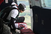 Kevin Burkart prepared to skydive toward his goal of completing 200 jumps in 24 hours. Burkart started the event, 200 Perfect Jumps, to raise money fo