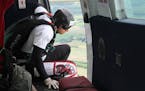 Kevin Burkart prepared to skydive toward his goal of completing 200 jumps in 24 hours. Burkart started the event, 200 Perfect Jumps, to raise money fo