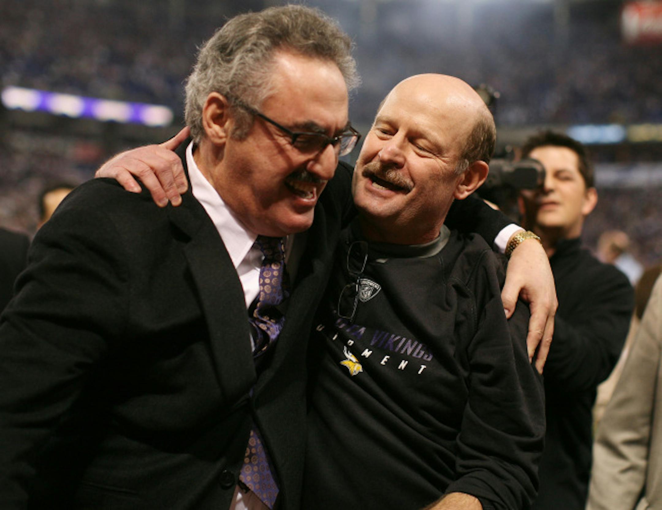 Vikings owner Zygi Wilf (left), with coach Brad Childress, celebrated the team's NFC North title after beating the New York Giants. Not all of Wilf's investments in the team have paid off as handsomely.